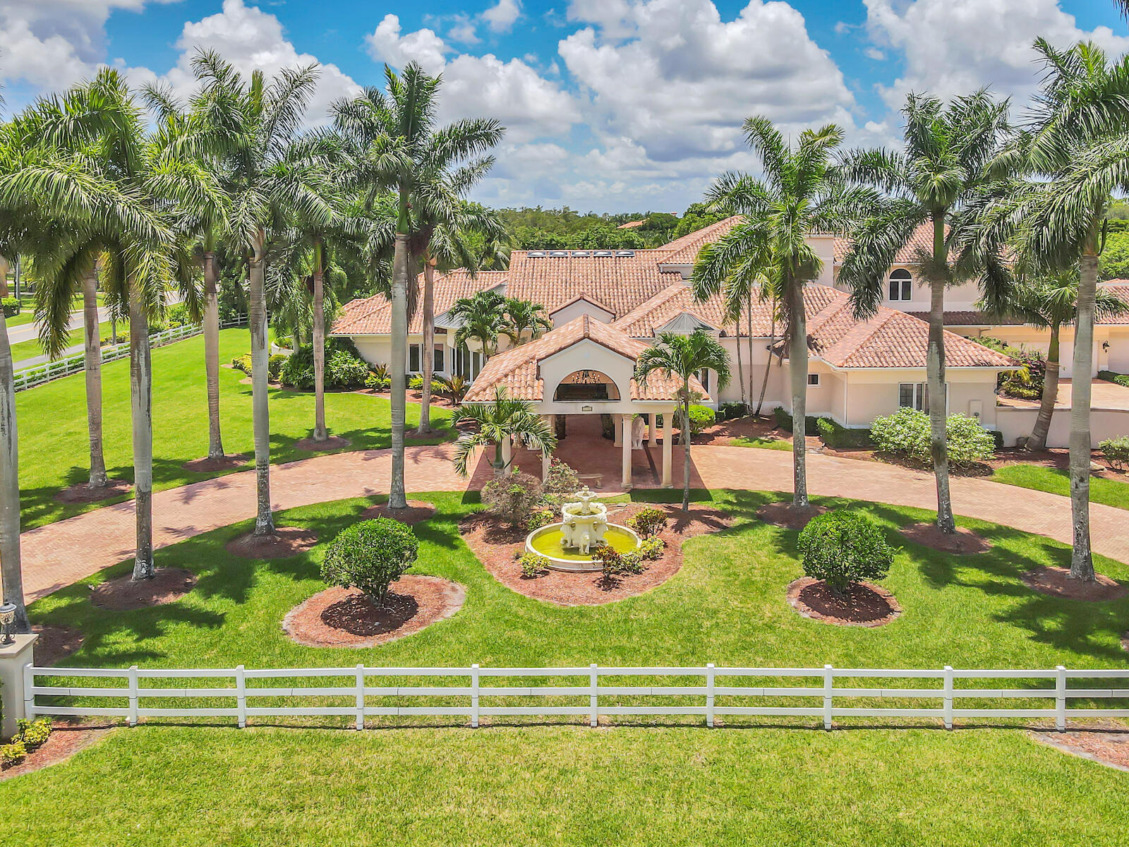 Welcome to this sprawling estate home situated on nearly 2.5 acres in the exclusive Wellington neighborhood of Paddock Park. Convenience, security and comfort is ensured with a Crestron home automation platform. Making this a truly smart home.

Upon entry, be greeted by soaring 28 foot ceilings complete with marble flooring throughout. The family room offers a newly installed wine cabinet, and a stunning custom built wood bar perfect for a game room and hosting large parties.
Offering 6 bedrooms including the oversize primary suite, complete with a luxury spa like en suite with a jet spa tub and pass through shower. Includes gorgeous newly built custom walk-in closets, featuring Rosso Venato Dolomite marble counter-tops from Italy. A new 1,400sq ft luxury theater room with Dolby ATMOS has been installed with state of the art Martin Logan sound system, 180" projection screen with JVC DLA projector and premium seating for 12. Photos coming soon.
Finally, step outside to the extraordinary outdoor living space with a full summer kitchen, brand new three person sauna and fully screened in pool complete with rock waterfalls.



Additional Upgrades Include:
2021 Complete impact windows
2021 4 New AC systems
2021 Upgraded reverse osmosis water system
2021 Exterior gutter system
2021 3 New gate systems
2021 6 New electrical panels
2016 Roof replacement
2016 Screen enclosure installation