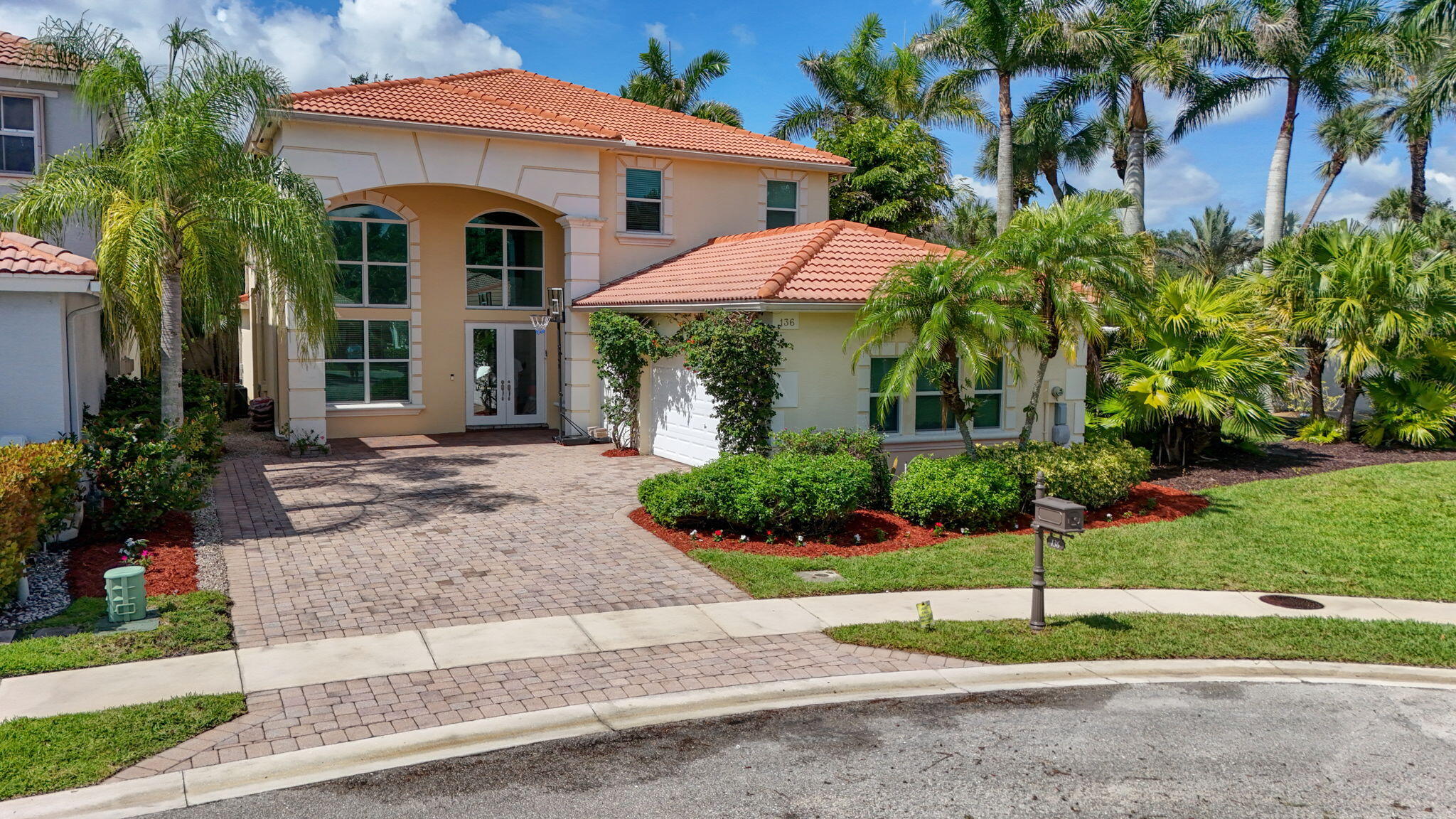 Move-in Ready 'Ibiza model' situated in a cul-de-sac street in the Via Condado Section of Mirabella. This model has 5 BRs, 3 ½ Baths & is 3,060 SF Under Air w/ 3 Car Garage & Master Bedroom on the 1st Floor. Upstairs 3 BR + Office/Bonus Rm or 5th BR. Features Full Impact Glass Throughout, Composite Wide Plank Flooring in Main Living Areas, Kitchen w/ Newer SS Appliances, Granite Countertops, refinished wood cabinetry & tile backsplash. Upgraded Window Treatments & Light Fixtures. Covered Lanai w/ phantom hurricane-rated screens and extended brick paver patio. Mirabella is a 24/7 manned, gated community that offers Resort-Style Amenities w/ Full Clubhouse, Social Room, Yoga/Pilates Room, Heated Pool, Fitness Center, Kids Clubhouse w/ covered playground, Toddler Pool & Tennis Courts & more