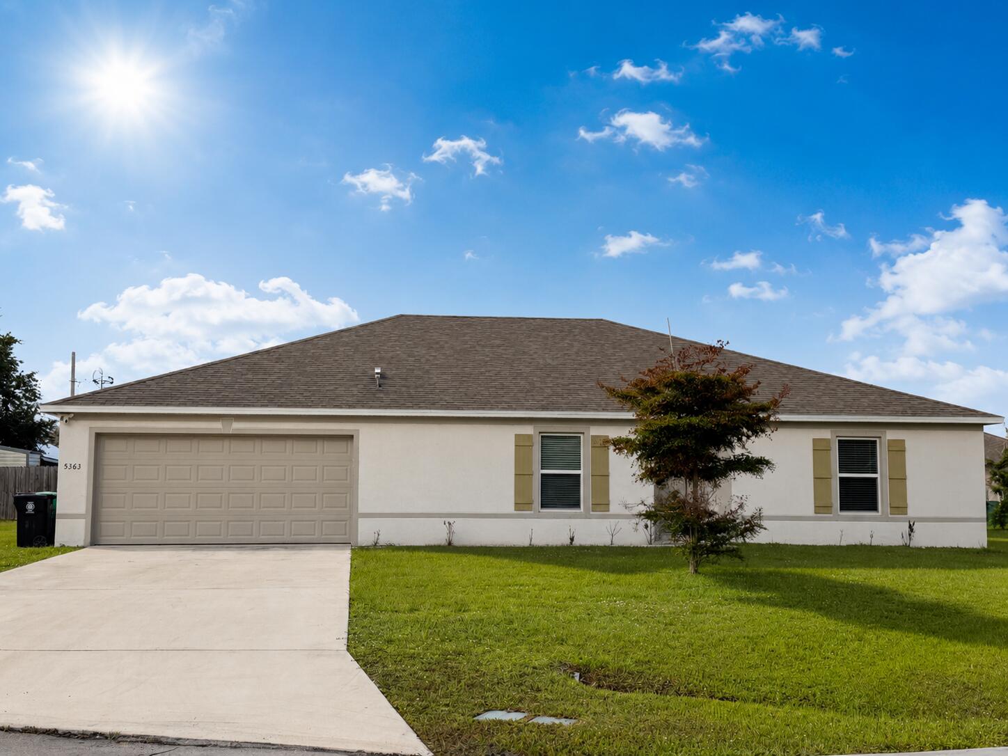 STUNNING 2024 REMODEL! Move-in ready home on a quiet cul-de-sac in Port St. Lucie. This home features an extensive 2024 renovation, showcasing sleek porcelain tile flooring throughout—a seamless, carpet-free living experience. The bathrooms have been beautifully upgraded with contemporary finishes and modern glass shower doors. Situated on a generous 0.26-acre lot, this property offers ample backyard space for privacy. Perfect for commuters, the home boasts an unbeatable location with rapid access to I-95. Whether as a primary residence or a smart investment, this turnkey opportunity is a must-see! Schedule your private showing today. All info deemed reliable but not guaranteed. Buyer agent to verify all measurements and school zones. EASY TO SHOW! Please use ShowingTime to schedule all private showings. Property was fully renovated in 2024, including all-new porcelain tile flooring and fully remodeled bathrooms with modern glass enclosures. Seller is motivated. Please include the AS-IS contract addendum with all offers. High-speed internet is available. Proof of funds or pre-approval letter required with all offers. Thank you for showing!