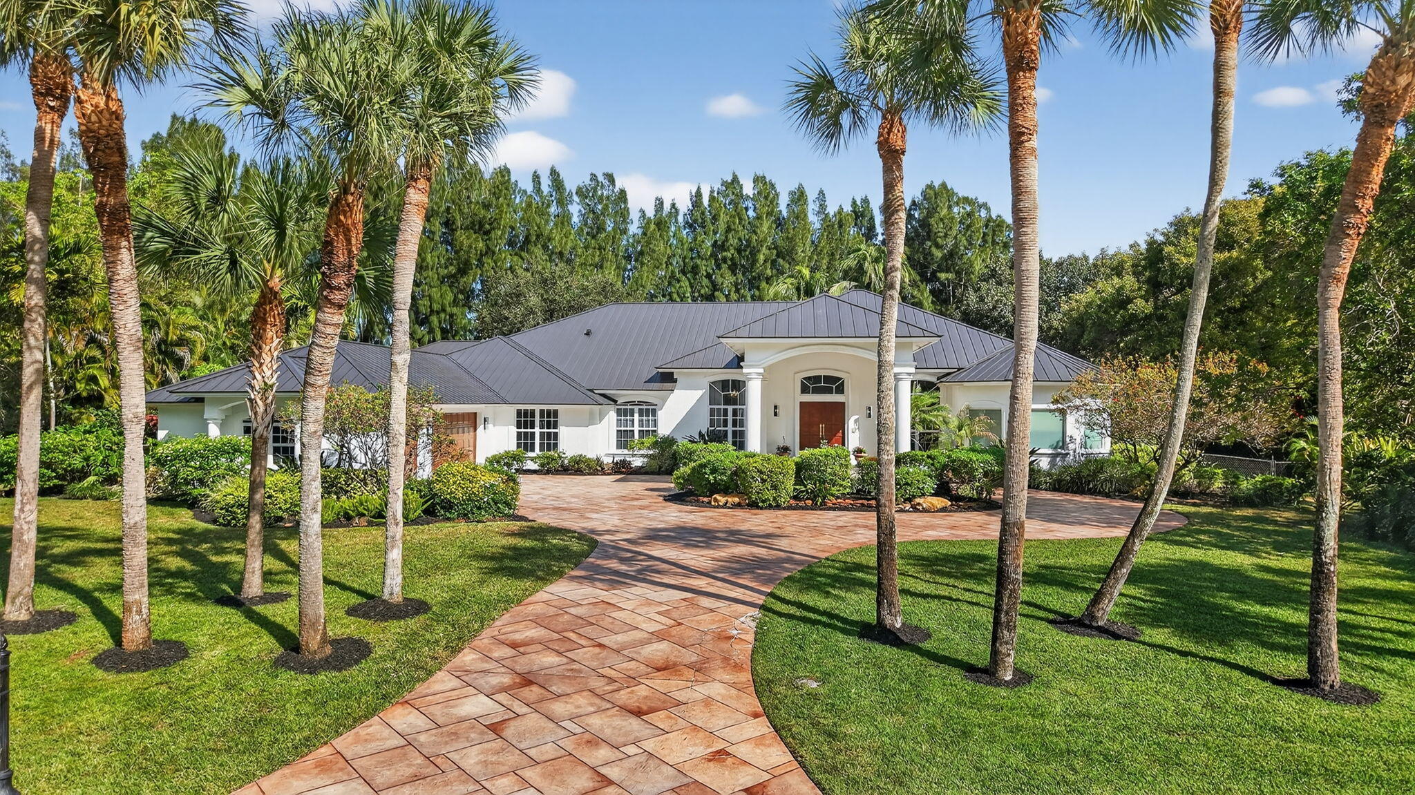 Brand NEW ROOF and NEW Exterior Paint! Luxurious 6-bed, 6.1-bath custom estate including an attached guest house. This nearly 6,300 SF single-story home is situated on a 1-acre lot within the secure, guard-gated Foxe Chase community. Just minutes from the vibrant downtown Delray Beach—a highly desirable small beach town boasting one of the nation's top-rated beaches—this property offers an ideal blend of privacy and accessibility. Zoned for the acclaimed Omni Middle and Spanish River High Schools in Boca Raton, it ensures top-tier education options. The expansive layout features a lavish primary suite with a cozy sitting area and spa-inspired bathroom, while the attached 2-bed/2-bath guest house includes its own living space, kitchenette, and tranquil Japanese garden. Entertain with ease in the chef's kitchen, complete with a walk-in pantry, double ovens, and an impressive 700-bottle wine cellar. The expansive, fully fenced backyard is a paradise, showcasing a resort-style saltwater heated pool and jacuzzi beneath swaying palm trees.(Additional highlights include a whole-house generator with a 500-gallon propane tank, impact windows, a 3-car garage with a Tesla charger. Located just moments from Atlantic Avenue, the beach, and Mizner Park, this one-of-a-kind property is perfect for those seeking luxury and lifestyle in a prime location.

DISCLAIMER: Information published or otherwise provided by the listing company and its representatives including but not limited to prices, measurements, square footages, lot sizes, calculations, statistics, and videos are deemed reliable but are not guaranteed and are subject to errors, omissions or changes without notice. All such information should be independently verified by any prospective purchaser or seller. Parties should perform their own due diligence to verify such information prior to a sale or listing. Listing company expressly disclaims any warranty or representation regarding such information.