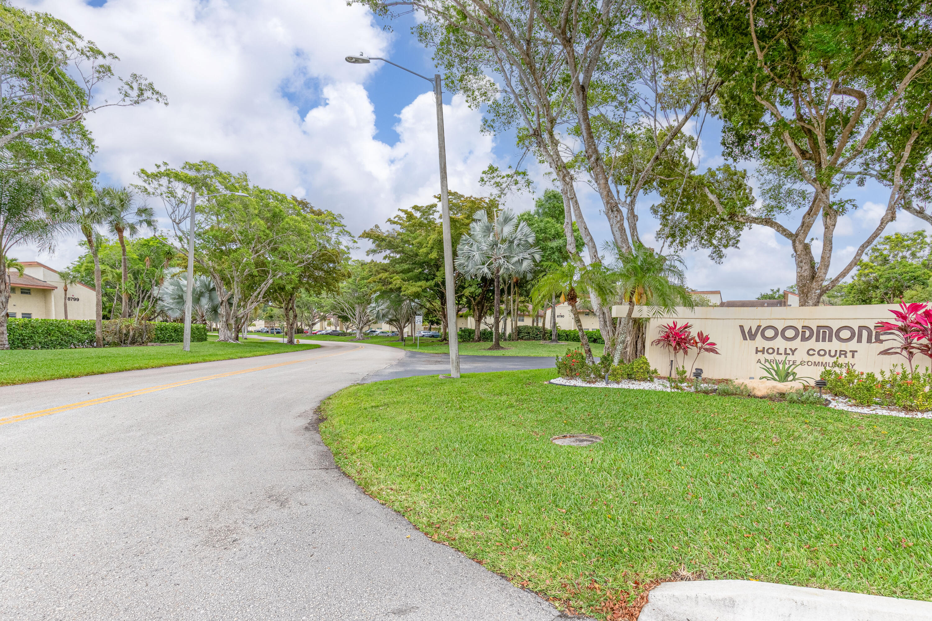 LOTS OF NATURAL LIGHT ENHANCE THE PANORAMIC VIEW OF GOLF AND WATER FROM YOUR PATIO AND FAMILY ROOM IN THIS ALMOST 1800 SQUARE FEET GROUND FLOOR CONDO.. 2 BEDROOM 2 BATH WITH DEN. DEN CAN BE CONVERTED TO A 3RD BEDROOM BY CLOSING THE LOUVERED PANELS. WALLS AND CEILINGS HAVE KNOCK DOWN, NO POPCORN. OVERSIZED PRIMARY EN-SUITE BR.WITH A WALK-IN CLOSET. HURRICANE SHUTTERS ON ALL WINDOWS AND SLIDERS. SEPARATE LAUNDRY ROOM WITH NEWER WASHER/DRYER. LOTS OF STORAGE THROUGH-OUT THE CONDO. NEIGHOBORHOOD POOL RECENTLY RENOVATED. ALL AGES WELCOME GOLF, TENNIS AND DINING AVAILABLE AT WOODMONT COUNTRY CLUB.
