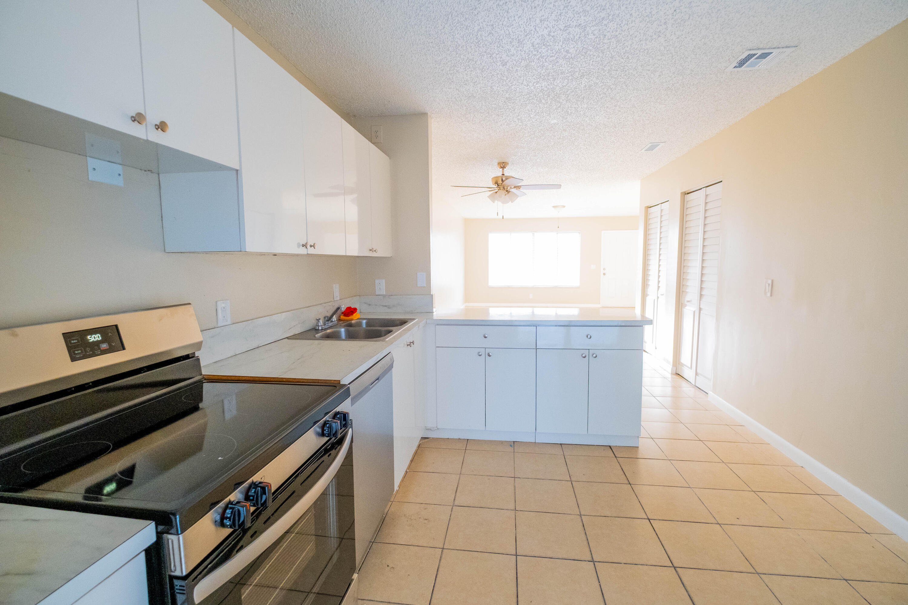 Great, beautifully maintained freshly painted 3 bedroom, 2 bath townhome offering a spacious open floor plan designed for comfortable everyday living. The family room, dining area, and kitchen flow seamlessly, creating an inviting space for both relaxing and entertaining. All Tile flooring runs throughout the entire home for durability and easy maintenance. The kitchen features ample cabinetry, solid surface countertops, and brand-new stainless steel appliances, new Washer and Dryer. Enjoy the fully freshly painted fenced backyard , perfect for outdoor living. Low HOA and prime location near shopping, dining, beaches, and major highways. Move-in ready and ideal for primary residence or  investment.