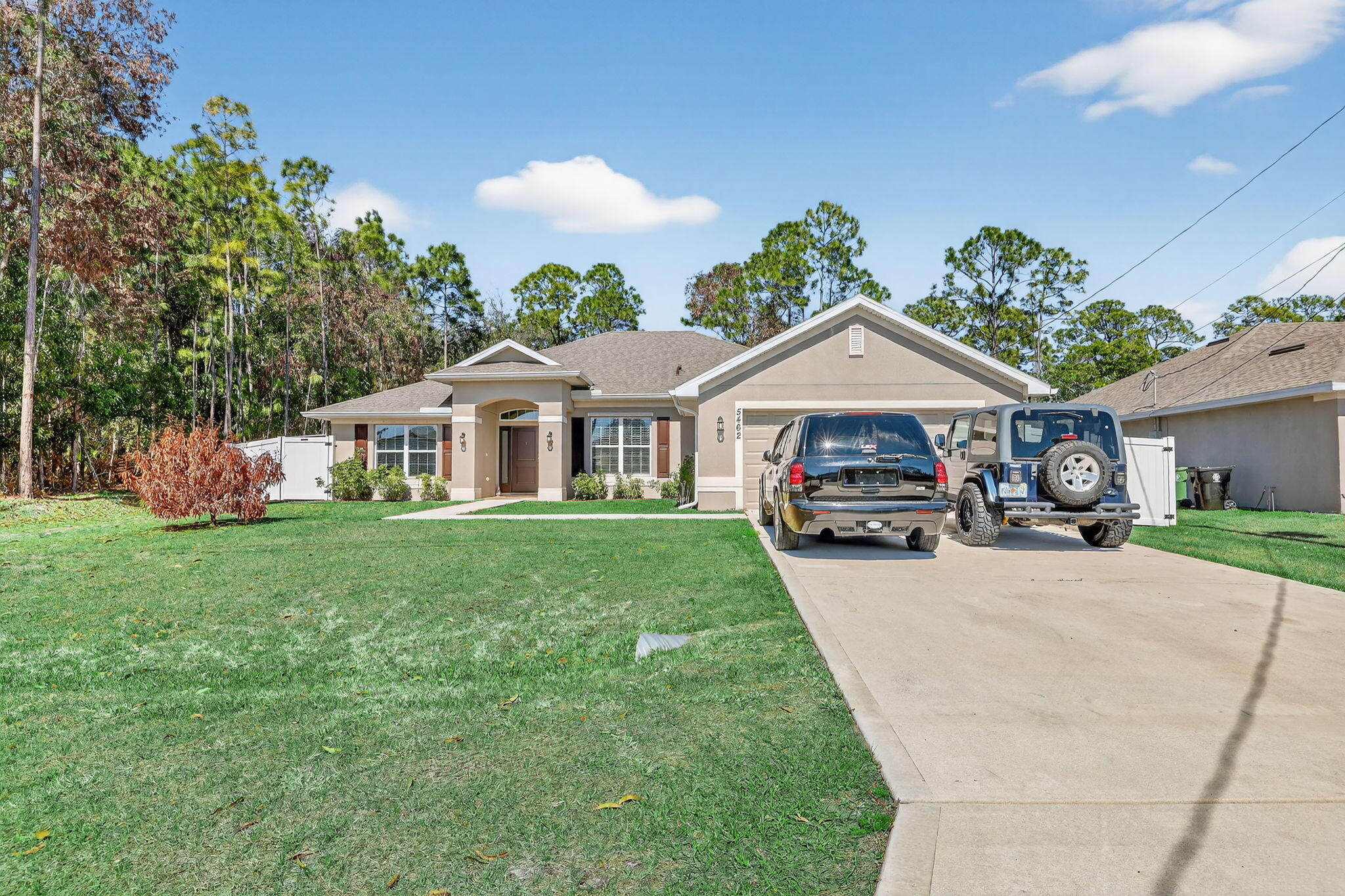 WELCOME TO THIS BEAUTIFULLY BUILT 2022 SINGLE FAMILY RESIDENCE OFFERING 4 BEDROOMS,3 FULL BATHS, A 2-CAR GARAGE,AND A 4 CAR DRIVEWAY. ,PERFECTLY POSITIONED ON A PRIVATE PRESERVE LOT COMPLETE WITH A NEW 6 FOOT WHITE PRIVACY FENCE.WITH 2265 SQUARE FEET OF LIVING SPACE(3100 TOTAL)THIS THOUGHTFULLY DESIGNED 3 WAY SPLIT HOME INCLUDES A FLEX ROOM, ADDING TO THE SPACIOUS AND FUNCTIONAL LAYOUT IDEAL FOR BOTH EVERYDAY LIVING AND ENTERTAINING AND THERE IS NO HOA TO WORRY ABOUT! BRIGHT OPEN KITCHEN WITH AMPLE 36 INCH CABINETRY,SLEEK STAINLESS STEEL APPLIANCES,AND A CONVENIENT BREAKFAST BAR AND BREAKFAST NOOK. OPEN CONCEPT LIVING AND DINING SPACES ARE PEFECT FOR FAMILIES AND GUESTS.TASTEFULLY UPDATED WITH MODERN FINISHES THROUGHOUT INCLUDING HIGH CEILINGS AND LARGE WINDOWS THAT ALLOW NATURAL LIGHT TO  FLOOD THE SPACE. THE EXPANSIVE PRIMARY SUITE INCLUDES DUAL WALK-IN CLOSETS, SEPARATE HIS AND HERS VANITIES, AND A LUXURIOUS SPA-LIKE BATHROOM FEATURING A LARGE SOAKING TUB AND AN OVERSIZED SEPARATE SHOWER. THE MODERN GREAT ROOM IS THE CENTER OF THE HOME, AND IT ADJOINS THE FORMAL DINING AREA AND UTILITARIAN FLEX ROOM WHICH CAN BE USED AS A DEN, OFFICE, OR SITTING ROOM. A SPACIOUS DOUBLE CAR GARAGE INCLUDES A MINI SPLIT A/C FOR YOUR COMFORT AND CEILING RACKS FOR EXTRA STORAGE. THE OWNER IS GRACIOUSLY INCLUDING THE BRINKS ALARM SYSTEM WITH SENSORS ON ALL WINDOWS AND DOORS, AS WELL AS 10 SWANN SECURITY CAMERAS WITH A DVR. THE LONG COVERED PATIO OVERLOOKS THE TRANQUIL YARD WITH LUSH GREENERY,  SERENE VIEWS OF THE PRESERVE,  NO REAR NEIGHBORS, AND SOLAR LIGHTS ALL ALONG THE NEW PRIVACY FENCE.  NESTLED IN A QUIET, FAMILY FRIENDLY NEIGHBORHOOD WITH EASY ACCESS TO LOCAL SCHOOLS, SHOPPING, AND MAJOR HIGHWAYS. LOCATED JUST MINUTES FROM THE AREA'S LARGEST COMMUNITY PARK, AND CLOSE TO CLOVER PARK, THE SPRING TRAINING HOME OF THE NEW YORK METS, THIS HOME OFFERS THE PERFECT BALANCE OF PRIVACY AND ACCESSABILITY. WHILE YOU LIVE APART FROM THE HUSTLE AND BUSTLE, YOU ARE VERY NEAR RESTAURANTS, SHOPPING CENTERS, ENTERTAINMENT, BEACHES, AND GOLF COURSES. YOUR PUBLIX IS THE PUBLIX AT SAINT ANDREWS, ALONGSIDE PNC BANK, A NAIL SALON, CUBAN RESTAURANT, MCDONALDS, DUNKIN DONUTS, SUBWAY, AND A DOLLAR STORE. THE POPULAR TRADITION ALSO AWAITS YOU, WITH ALL TYPES OF EVENTS , FARMER'S MARKETS, RESTAURANTS AND FACILITIES. CULTURAL ATTRACTIONS INCLUDE THE BOTANICAL GARDENS AND WILDLIFE CENTER. DON'T MISS THIS OPPORTUNITY TO OWN A NEWER CONSTRUCTION HOME IN A PRIME AND GROWING LOCATION WHERE YOU CAN LIVE AS PEACEFULLY OR ACTIVELY AS YOU WISH,  A CONVENIENT CABANA BATH PROVIDES EASY ACCESS FOR GUESTS AND FUTURE OUTDOOR LIVING ENHANCEMENTS AS ADDING A POOL. TWO BEDROOMS ARE LOCATED NEAR THE CABANA BATH AND THE THIRD IS ON THE OTHER SIDE OF THE KITCHEN, NEXT TO ANOTHER FULL BATH AND THE LAUNDRY ROOM WITH STORAGE. MAKE THIS ALMOST NEW HOME YOUR OWN.