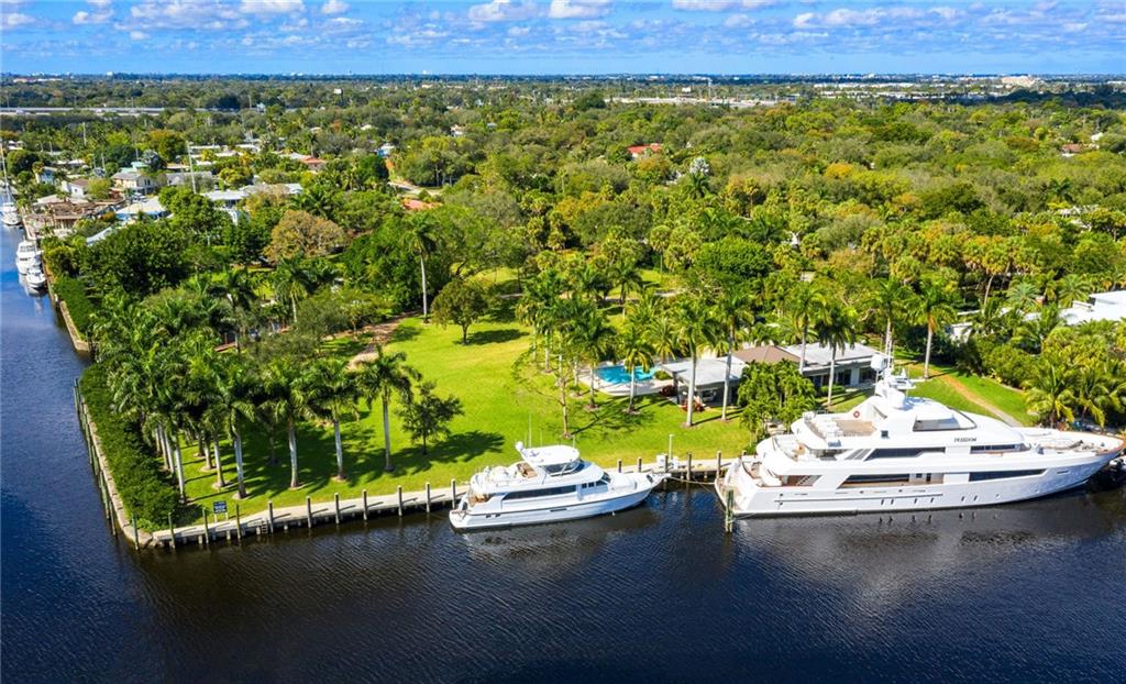 Dock Your Mega Yacht.  Gated Waterfront Estate with 4.5  acres of land and 1103 feet of deep water dockage with one stretch of 300 ft which can handle the largest yacht. This spectacular property is Located on the New River in Fort Lauderdale.  Possibly could be subdivided or just build one large estate. The owners home, built in 2018, is a 1 bedroom and 1.5 bath with a salt water pool and the finest finishes.  Gazebo set in the center of the property to watch the parade of yachts go by. The most beautiful landscaping throughout makes you feel that you have stepped back in time with all of the beautiful trees and lighting. This could be one of the last largest pieces of property and deep water in Fort Lauderdale. If you want privacy this is it.  Truly a must see. Dock Your Mega Yacht.  Gated Waterfront Estate with 4.5 acres of land and 1103 feet of deep-water dockage.  Best of Both worlds. Tons of land and tons of dockage. This spectacular property is Located on the New River in Fort Lauderdale.