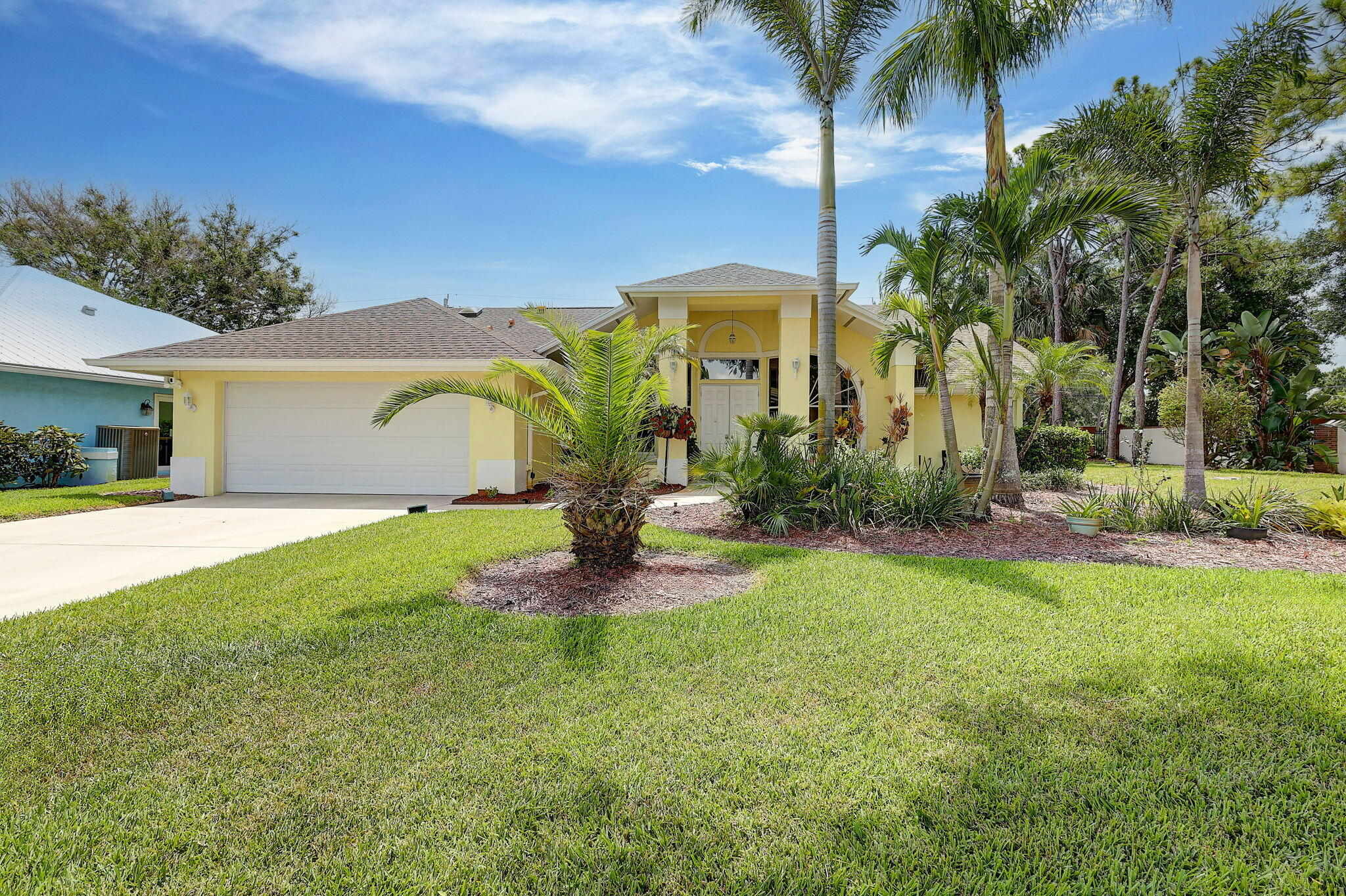 Palm trees sway over your private, screened pool at this move-in ready 3BR/2BA home in Palm City's sought-after Oak Ridge gated community. Luxury vinyl plank floors (2019) flow through a bright, open layout built for gathering. The updated kitchen (2020) shines with quartz counters and soft-close cabinetry, while the master suite offers a quartz double vanity and porcelain soaking tub. A fenced backyard and diamond-bright pool finish set the stage for morning coffee or evening swims. Roof (2016), AC (2026), and hot water heater (2025) are done. Enjoy the community pool, tennis courts, and basketball court. Minutes to shopping, dining, and the beach!