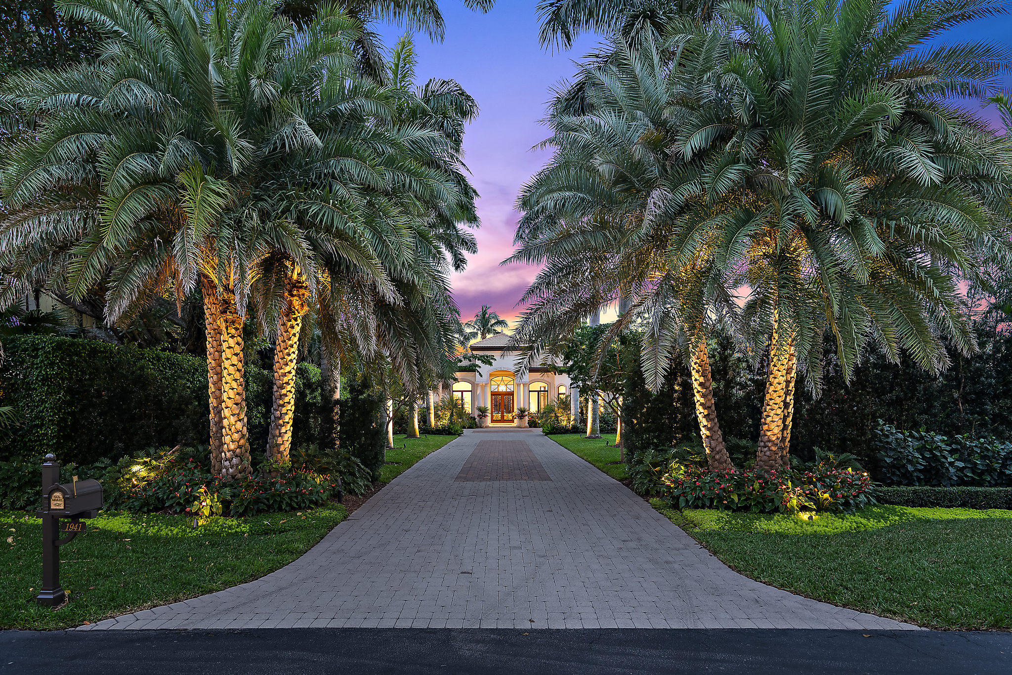 STUNNING Intracoastal water views with perfect southern exposure in this beautiful one-story estate home. Highly sought after small gated water community with light and bright volume ceilings and open floor plan. Tropical Palm Beach, treelined driveway brings you to the grand entrance which offers recent updates inside and out! All new PGT impact windows and sliding doors. A new dock featuring (2) 40 foot boat lifts for an 18k and 25k lb boat and additional dockage for up to 100ft yacht. Full home generator, 3 new top of the line Lennox HVAC systems. The transitional decor with marble floors throughout is complimented by a gourmet chef's kitchen w/Viking gas range, commercial cook top hood, and 2 Bosch dishwashers. Spacious master suite with tranquil water & skyline views offers peaceful sitting area, office/fitness room and oversized his and her closets. Guests will be pleased with their private ensuite bedrooms. Boasting OVER AN ACRE of land, family and friends can enjoy the spacious entertainment outdoor area along with the privacy of the mature, manicured landscaping. This unique, gated community with a small enclave of waterfront homes is a Boater's dream and close to PGA Corridor with popular restaurants, golf, shopping, theatre and the Benjamin School. Bring your most discriminating Buyer!