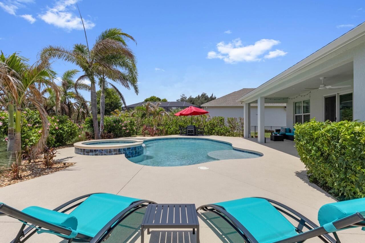 Experience modern luxury in this stunning, 2021-built GHO home. This open-concept layout is elevated by premium upgrades, including crown molding and plantation shutters throughout. The kitchen features quartz counters, GE appliances, double wall ovens, and an expansive island. Outside is your private oasis: heated/chilled pool and spa surrounded by lush landscaping—perfect for entertaining & relaxing. Three-car garage with epoxy flooring. Complete with impact windows and doors, security cameras, and a gated community of just 45 homes, this property offers ultimate comfort and peace of mind!