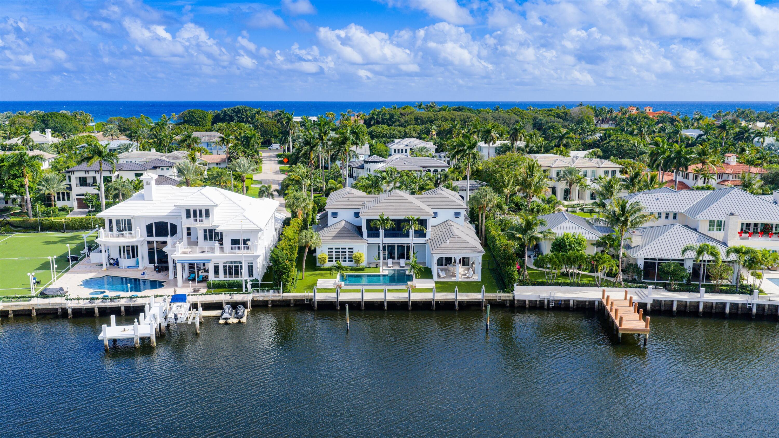 British West Indies-inspired estate fronting 143± ft. on a no-wake zone of the  Intracoastal waterway. Custom construction by Seaside Builders with design by Richard Jones Architecture. Casually elegant open living areas flow to waterfront loggia and pool. Luxurious master suite. Fabulous location near the beach and Atlantic Avenue's shopping and dining. Near the beach and Atlantic Avenue, this British West Indies-style Intracoastal estate offers the ultimate waterfront lifestyle, complete with protected dockage.  Directly on the Intracoastal in the desirable Seagate beachside neighborhood, this British West Indies-inspired estate fronts 143± feet on a no-wake zone of the Intracoastal waterway, featuring protected deepwater dockage and wide vistas across the waterway.  This luxurious custom residence combines the top talents of Seaside Builders and Richard Jones Architecture, both noted Delray Beach-based firms.  Placing an equal emphasis on beauty, quality, and practicality, the casually elegant 2-story estate home is generously sized with a total of 8,702± square feet including an elevator, 5 bedrooms, 5½ baths, and 4-bay garage.  High-end finishes feature marble and hardwood floors plus impact-glass windows and exterior doors.  View-filled glass doors open to the waterfront loggias and pool patio from the seamless living dining rooms as well as from the club room and combined family/breakfast room and chef's kitchen.  On the second floor, the spacious master suite opens to a private waterfront loggia and offers a sitting room, 2 walk-in closets and a luxurious bath.  Upstairs, the loft-style sitting room is accompanied by 2 bedroom suites each with their own private balcony and bath.  Offering Delray Beach living at its finest, the estate is perfectly located in a serene waterfront setting within walking distance of the beach, less than a mile from charming Atlantic Avenue's cosmopolitan shopping and dining in the city's vibrant downtown district.  DISCLAIMER: Information published or otherwise provided by the listing company and its representatives including but not limited to prices, measurements, square footages, lot sizes, calculations, statistics, and videos are deemed reliable but are not guaranteed and are subject to errors, omissions or changes without notice. All such information should be independently verified by any prospective purchaser or seller. Parties should perform their own due diligence to verify such information prior to a sale or listing. Listing company expressly disclaims any warranty or representation regarding such information. Prices published are either list price, sold price, and/or last asking price. The listing company participates in the Multiple Listing Service and IDX. The properties published as listed and sold are not necessarily exclusive to listing company and may be listed or have sold with other members of the Multiple Listing Service. Transactions where listing company represented both buyers and sellers are calculated as two sales. "No payments made until title passes" Some affiliations may not be applicable to certain geographic areas. If your property is currently listed with another broker, please disregard any solicitation for services. Information published or otherwise provided by seller, listing company or its representatives is deemed reliable but are not guaranteed and subject to errors, omissions, or changes without notice. Copyright 2024 by the listing company. All Rights Reserved.