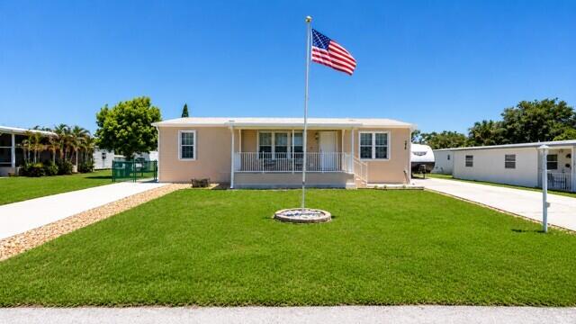 Fantastic & Rare Opportunity to Own a Newer 2019 Doublewide on a HUGE Oversized Lot & a Half!  NO HOA~ALL AGES WELCOME~ OWN THE LAND~ Tons of Parking w/2-concrete extended driveways.  Fenced in Yard w/12' x 10' Newer Shed!  This fantastic home features Open Floor Plan w/White Kitchen Cabinets, TWO Pantries, White Appliances, Kitchen Island.  Interior Laundry Room w/Washer & Dryer w/lots of storage space.  Main Bedroom has Walk-in Closets, Lg Soaking Corner Tub, Separate Shower & plenty of Storage Cabinets! 2 additional Bedrooms & Bathroom.  Open Front Porch & Enclosed Back Patio Sunroom w/Impact Windows both w/Concrete Upgraded Patios & Stairs.  This home sits high above the other homes!  Extra Insulation added.  Both 30amp & 50amp Junction Boxes.  Bring your Toys!  This Home has it ALL!!!