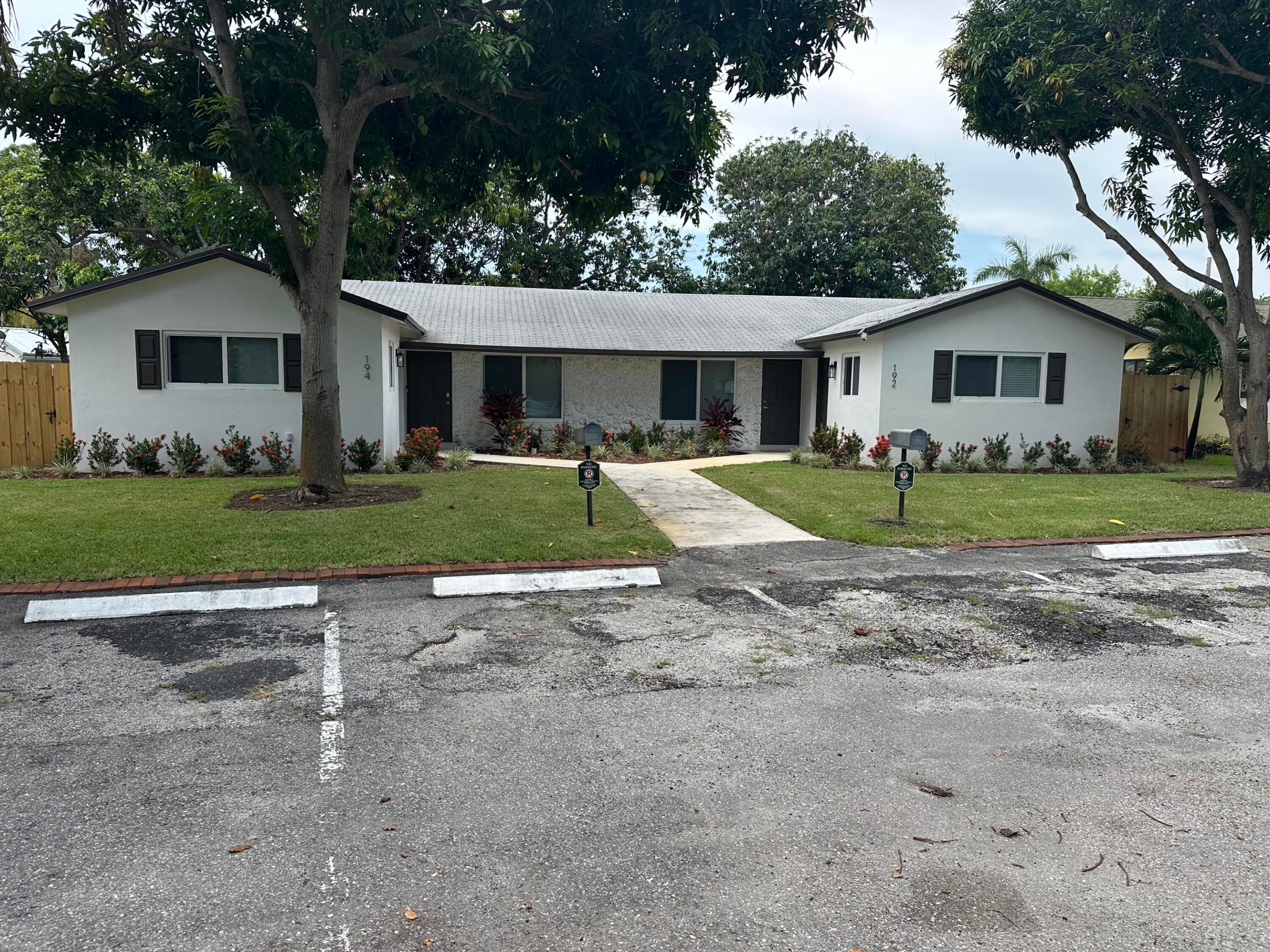 Welcome to modern elegance in the heart of Boynton Beach. This exquisite corner unit offers a luminous living space with impact windows & doors flooding with natural light. Step inside to discover a seamless blend of style & functionality with wood flooring throughout, fully upgraded bedrooms, bathrooms, and kitchen.  The living area boasts an open floor plan, fully remodeled kitchen with quartz countertops, complete with sleek finishes, making it a cooking enthusiast's dream. Enjoy the outdoors with the private, fully fenced yard. Situated just steps from Bethesda Hospital & minutes to the beach. To best suit your needs, this unit is Offered fully furnished or can be delivered totally vacant.