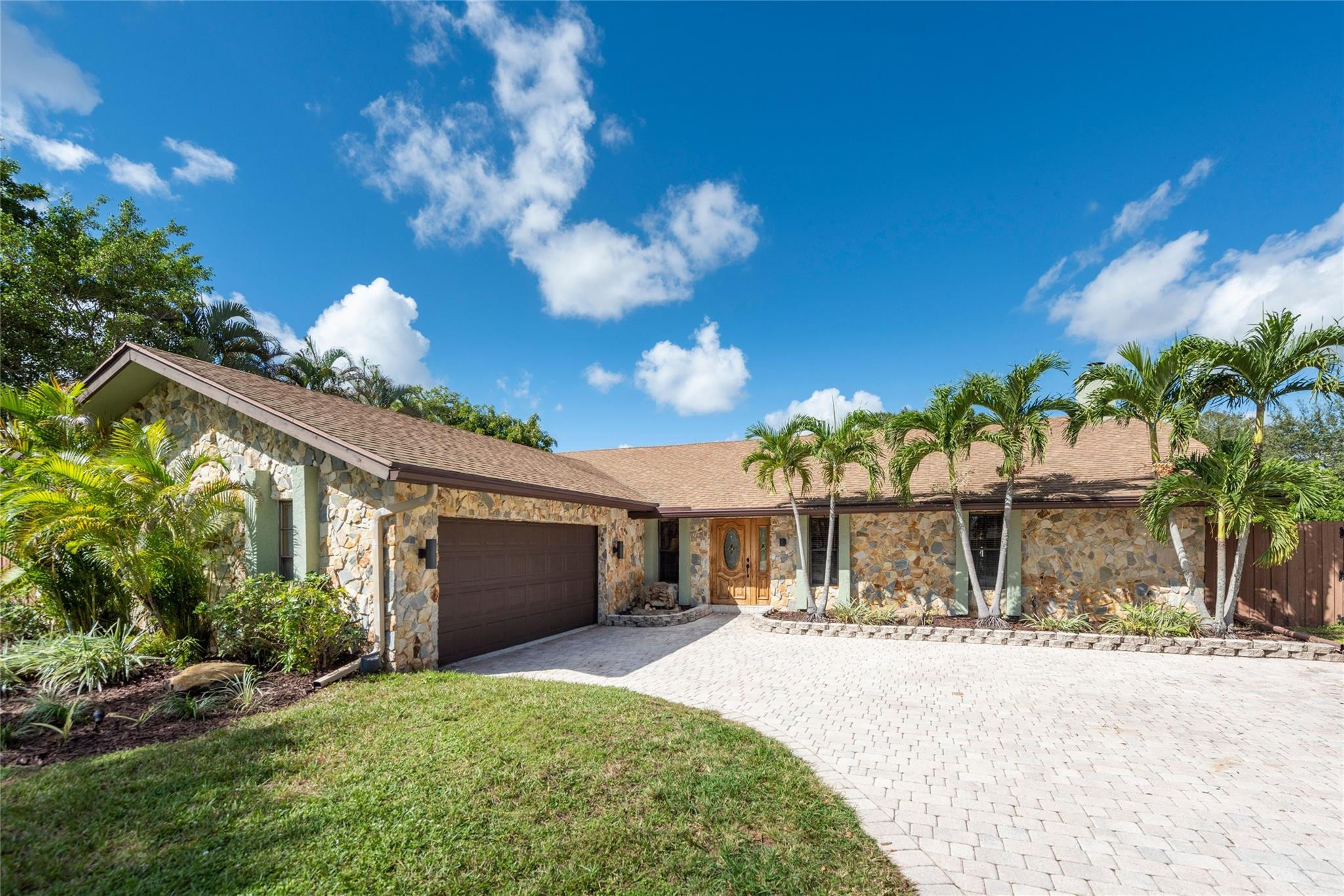 Tropical Oasis 4/2 Spacious floor plan flows thru all living space w/Hi Ceilings, Hardwood Floors, Nice Size Bedrooms, + Indoor Entertain. Bar (Double Tap Beer keg + Temp. controlled Wine Cooler)- Huge Family rm w/Fireplace + 200sf Bonus Rm/Lanai. All leads 2 Private Key West Style Pool/Patio Deck w/Waterfall, Hot Tub, Infra Red Sauna, Fire Pit + Covered Outdoor Kitchen + wood deck w/Water Feature, Custom Made Charcoal Grill + Propane Grill, Mini Fridge -NO homes directly behind you. Granite Kitchen w/Breakfast bar + Island cook top, double oven, bottom freezer Fridge, Microwave Nook w/Ample Cabinetry. 14X15 Master Bedroom offers Large Glass Shower + raised double basins. Lge Laundry Rm w/7' x 5' Alcove provides space for 3rd Bathroom. 12000 Sq Ft lot affords room for RV, Camper, Boat ++ Walking distance to all 3 schools located in One of the Best Communities in Plantation! Convenient to Shopping, Costco, 595, Theatres, Restaurants and 15 minutes to the airport and 20 minutes to Fort Lauderdale or Hollywood Beach!