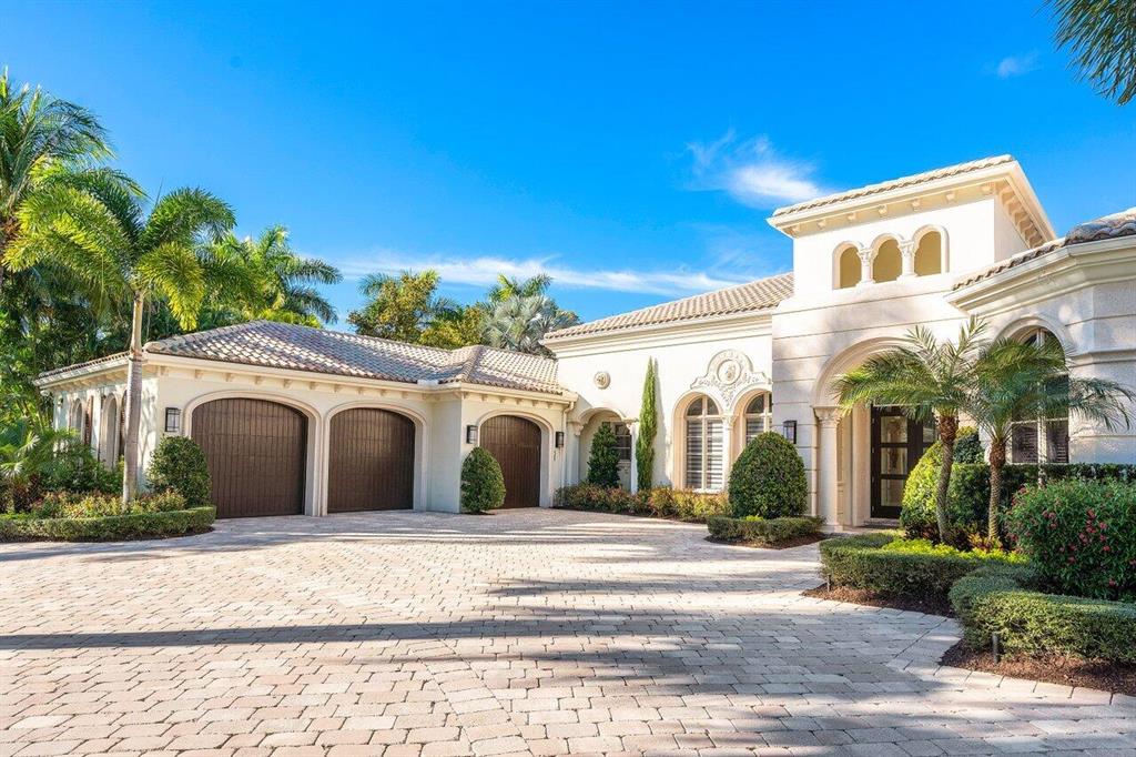 Stunning, updated Castillo floor plan on a private water feature home site in the Grand Estates section of exclusive Old Palm.  This impeccably maintained home won't last long!  Featuring a formal living room with quartz surrounded gas fireplace , porcelain floors & counter tops, upgraded interior lighting, upgraded landscape lighting, gorgeous landscaping in the front & back.