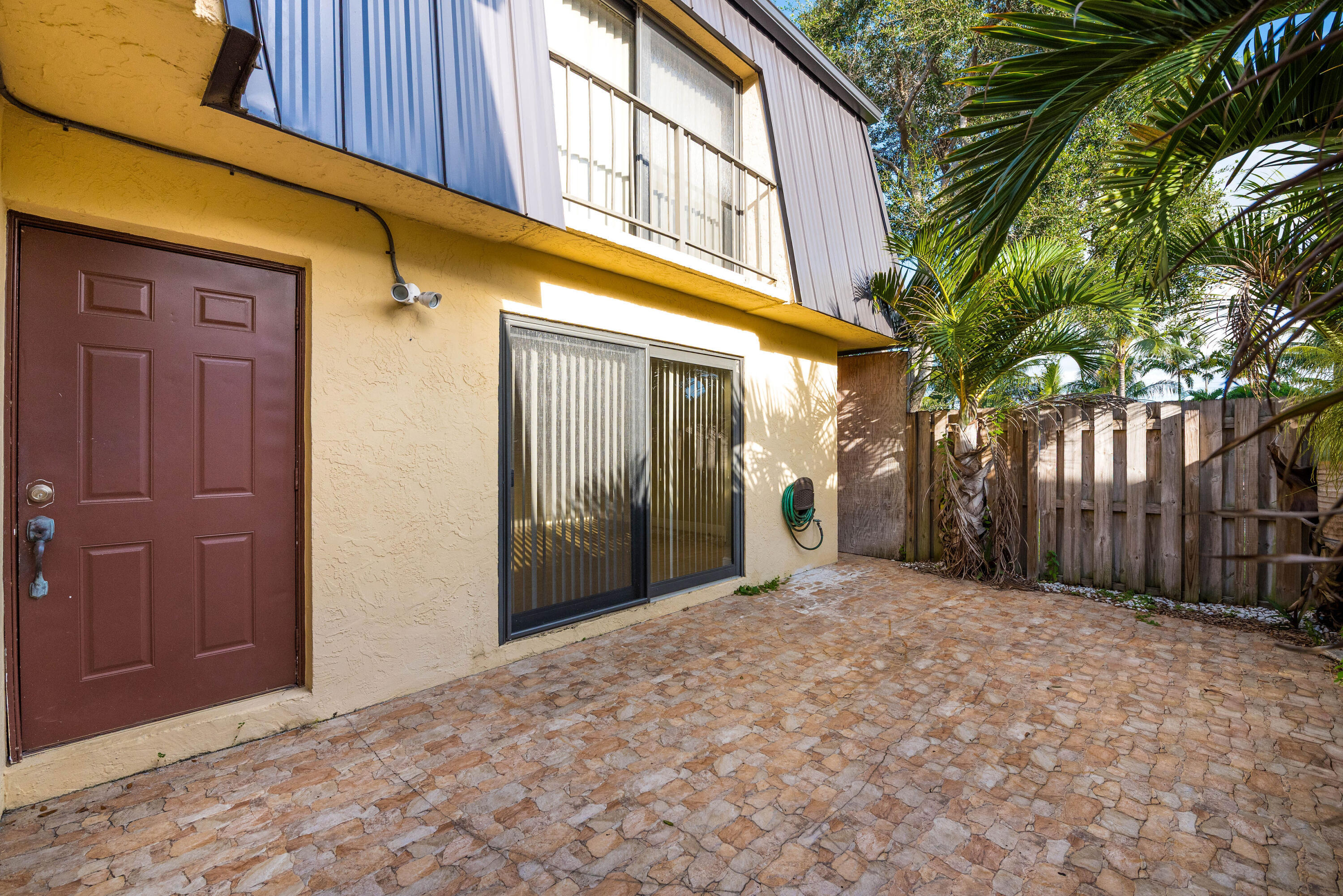 **MLS Description:**  Beautifully updated **2-bedroom, 2.5-bath townhome** in the gated community of Waterside Estates. This move-in ready home features an open floor plan, granite countertops, stainless steel appliances, dark wood cabinetry, a mosaic backsplash, breakfast bar, tile flooring, and abundant natural light. Enjoy a private fenced courtyard perfect for relaxing or entertaining. Community amenities include a pool, scenic lake, and gated entry, all conveniently located near shopping, dining, and major highways. Don't miss this incredible opportunity!