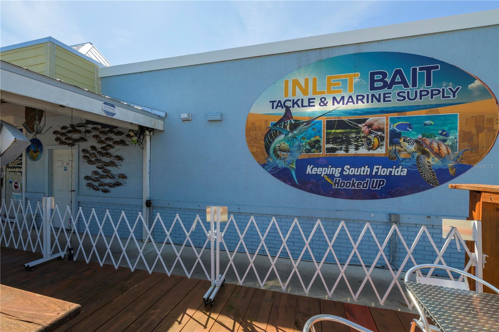 Rare waterfront commercial opportunity with multiple income streams and endless growth potential! This turnkey mixed-use property features a successful bait shop generating $40K+ monthly during peak season, plus a leased food truck, U-Haul contract, water delivery business, pontoon boat, storage containers, and rental parking income. Zoned C-3 Commercial, allowing for retail, restaurant, entertainment, marina, tourism, and mixed-use concepts. The 3,823 SF building sits on 0.7685 acres and includes 3-phase electric, two wells, generator, grease traps, public restrooms, security system, and living quarters. Prime highway frontage near the water offers exceptional visibility and traffic. Expansion potential includes outdoor seating, additional parking, and up to 3-story development. Incredible opportunity to own a fully operational waterfront commercial property with multiple established income streams and significant future upside. Property includes a thriving bait shop with inventory, vendor relationships, drive-through service window, indoor bait tanks, and outdoor replenishment tanks. Additional assets include a leased food truck generating monthly income, pontoon boat, water delivery business with tank truck and trailer, U-Haul contract, storage containers, and rental parking spaces. Flexible C-3 zoning allows for retail, restaurant, marina, tourism, entertainment, mixed-use, and redevelopment opportunities. Features include 3-phase electric, two wells, generator, grease traps, public restrooms, security cameras, living quarters, and fully equipped kitchen. New metal roof currently being installed. Prime waterfront highway location offers exceptional visibility, accessibility, and strong traffic flow from both locals and tourists. Excellent opportunity for investors, owner-operators, or developers seeking immediate cash flow and long-term growth potential.
