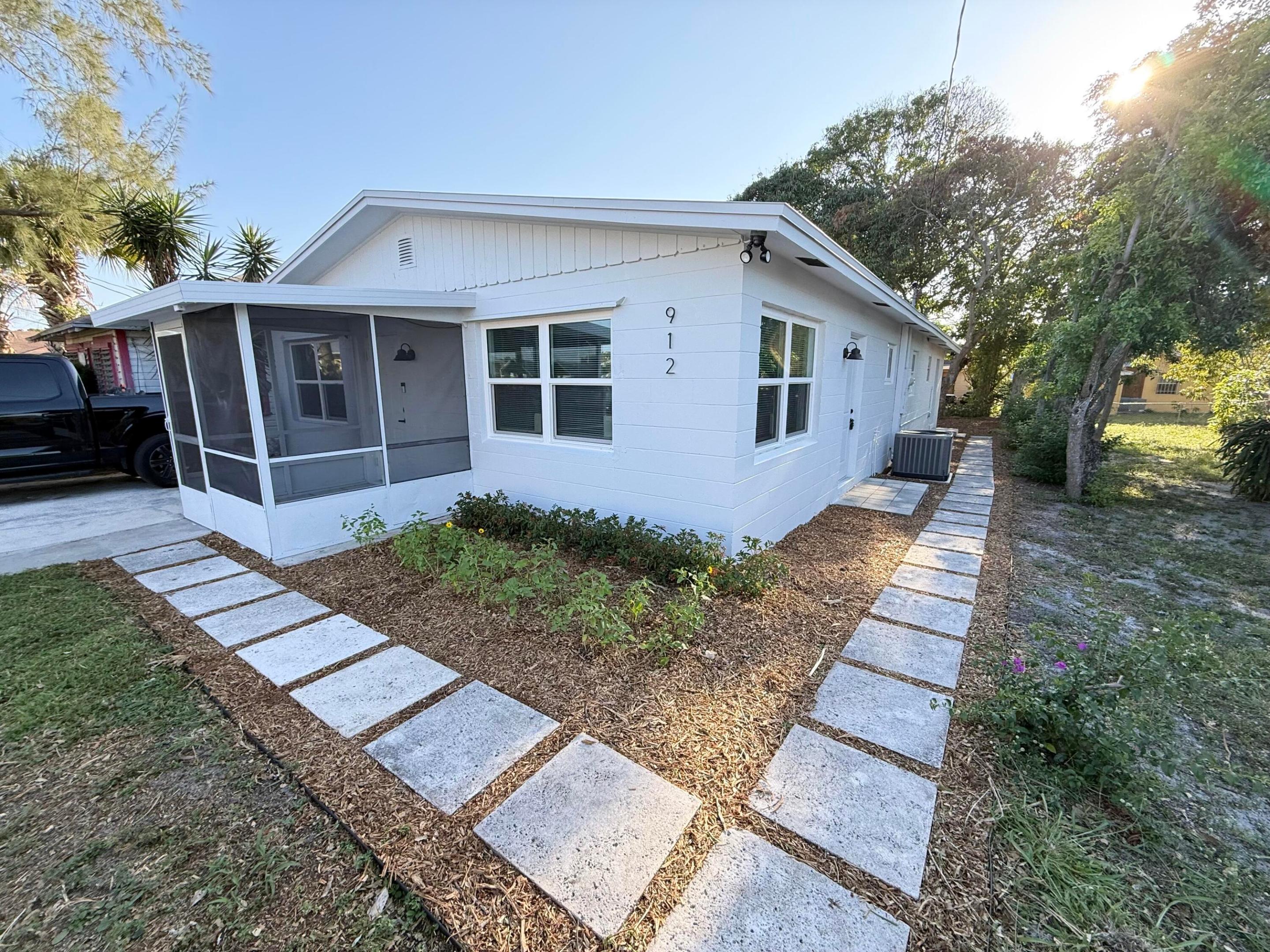 Updated 4-bed, 2-bath NO HOA home CBS home. This residence offers ultimate peace of mind with a BRAND NEW 2026 ROOF. The interior is light, bright, and modern, featuring tile flooring throughout (no carpet!), a freshly updated kitchen with brand new stainless steel appliances and granite countertops, no popcorn ceiling, updated bathrooms, and newer central AC. Freshly painted inside and out with lush new landscaping and mature mango trees, the home also features a private screened-in porch. Located just minutes from dining and shopping of Downtown Stuart and the world-class beaches.
