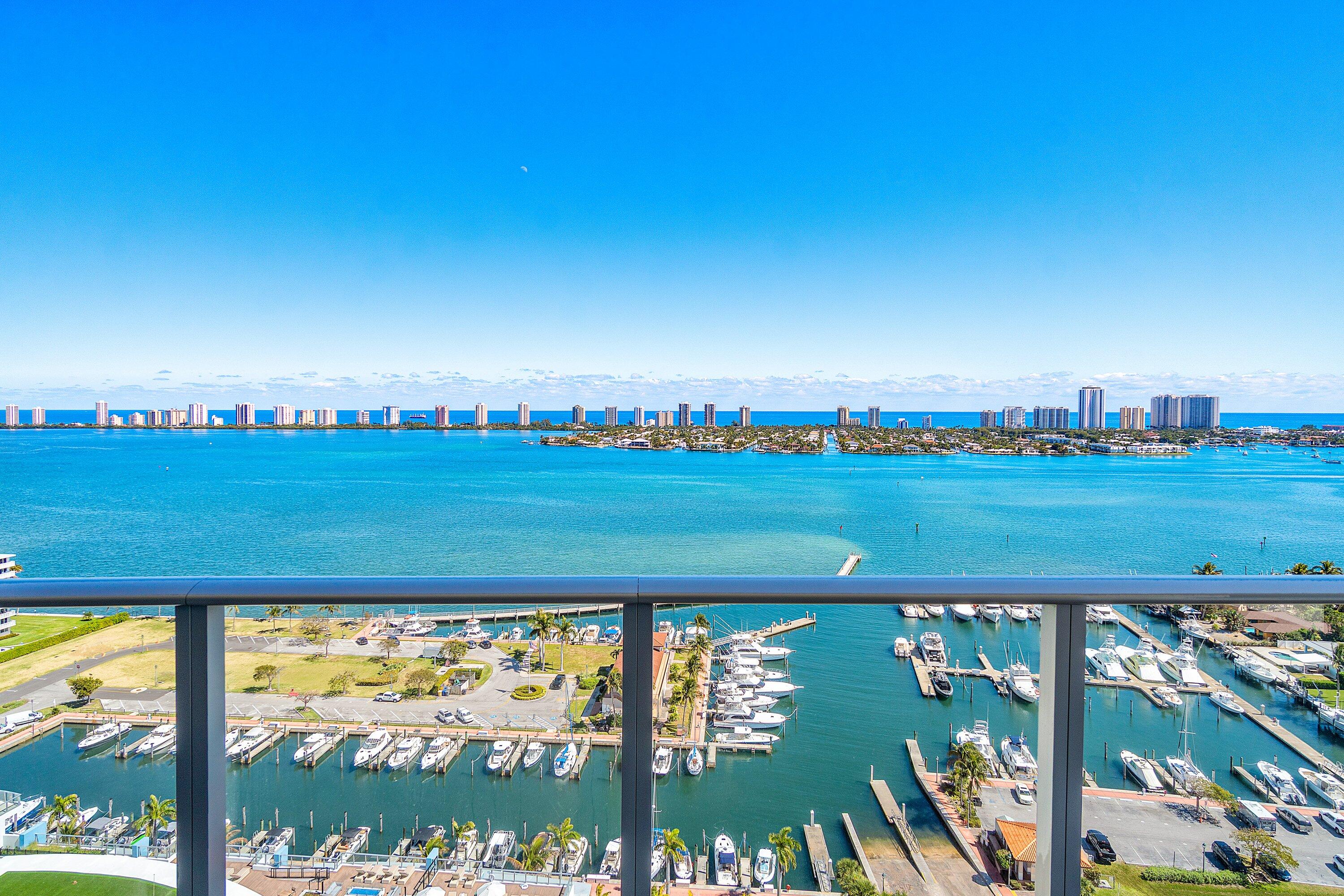 Waterfront resale opportunity for the H Residence, on the 21st floor at Nautilus 220 (N220) with East/South/West exposure and a corner/end unit for privacy. This brand-new residence is one of the largest onsite with 2 assigned parking spaces/storage unit as well as a private elevator and foyer entrance. It offers a massive wrap-around terrace, and a separate terrace for the guest bedroom(s). Incredible natural light, water views throughout, with sunrise views to the east and sunset views to the west. Three-bedroom 3.5 bath + DEN, full laundry room, floor-to-ceiling hurricane impact sliders throughout, 10' ceilings, Miele appliances, Wine Cooler, European porcelain tile/cabinetry, quartz countertops, walk-in closets, glass enclosed shower(s), soaking tub, frontlit mirrors, and dual vanity. AMENITIES: 6th floor pool deck w/ resort-style pool, firepit stations, jacuzzi/spa, grill stations, resident pavilion, dog park/wash station, and putting green. Rooftop lap pool. Club Room, event space, guest suites, conference rooms, gym, spin/yoga studios, sauna, steam room, locker rooms, massage room, bowling alley/lounge, gaming tables, theater, golf simulator, soundproof music room, kids' playroom, and teen room. Celebrity Chef David Burke's waterfront restaurants: Seahawk Prime and Birdie Dockside Bar & Grill and Lobby Café/Market to come. This property is full-service resort-style with 24/7 security, resident assigned parking, valet or self parking, vehicle charging stations, five-story parking garage, onsite concierge and property management, security, mailroom, package porter, bike/paddleboard storage, and beach access and parking on Singer Island.   Live the luxury lifestyle in the Palm Beaches at this exquisite waterfront oasis, with amenities galore and incomparable water views! Amazing waterfront oasis, with amenities galore and incomparable water views! Beautiful design, artwork, expanding neighborhood, investment opportunity!