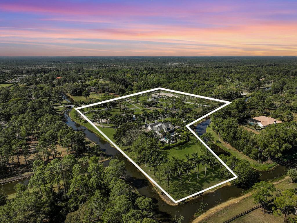 Gardens
Experience the ultimate in luxury equestrian living at 14639 Crazy Horse Lane, a 10-acre estate in the prestigious Caloosa community. This meticulously maintained property offers unparalleled facilities for horse enthusiasts alongside a private main house with a pool and a charming guest house—ideal for family, staff, or guests.
Equestrian Features:
Arena: 220' x 110', IDA Premier Footing (2022) with a covered viewing pavilion
Horse Exerciser: Six-horse capacity with new Equine flooring (2022)
8 Pastures: Water access, 6 Tiki hut run-ins (2 with field stalls), 2 medical paddocks
Fencing: White PVC, fenced and cross-fenced
Barn Features:
6 Stalls: Four 14' x 12', two 8' x 10'
Aisle: Rubber paver flooring
Rooms: A/C tack room/office, feed room, 5 grooming stalls Fly System: In main barn & run-in sheds
Gathering Porch: Flex space for the season (can allow for 5 additional stalls)
Utilities: 5KW generator, custom hurricane roll-down shutters
Beyond its equestrian excellence, Caloosa offers 32 acres of horse trails, a community horse park, tennis & basketball courts, pickleball courts, and a clubhouse. Conveniently located near PGA Boulevard, top golf courses, The Gardens Mall, medical centers, and Palm Beach International Airport, this estate blends tranquility and accessibility.