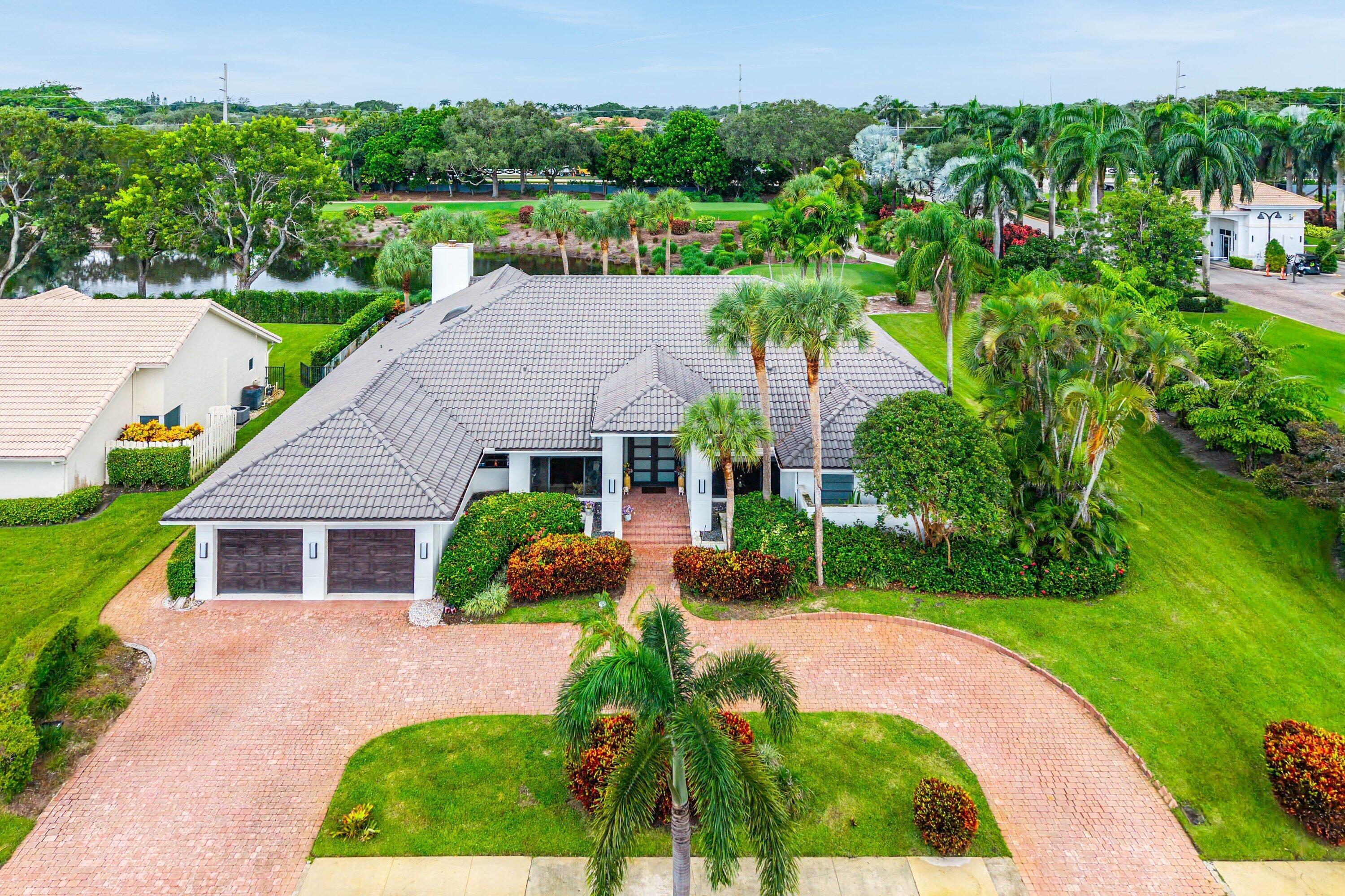 Beautifully updated and meticulously maintained, this exceptional residence offers over 4,000 square feet of elegant living space on a private 1/3-acre.. Featuring four ensuite bedrooms (one used as office), the thoughtfully designed split floor plan boasts soaring vaulted ceilings and light-filled throughout.The home offers expansive living and family rooms, a cozy fireplace, a custom wet bar, and a formal dining room.  The Chefs kitchen and bathrooms are all updated!  Step outside to a breathtaking tropical retreat where a sparkling pool overlooks manicured fairways and tranquil waterviews—creating an extraordinary setting for relaxation and entertaining. Ideally located within walking distance to the clubhouse, golf, tennis, pickleball, fitness center, and dining venues. Bocaire Country Bocaire Country Club is a boutique club with only 239 homes offering resort-style amenities, championship golf, racquets, 24 hr fitness, high-end dining & a welcoming community.  Parents, children and grandchildren also have access to the amazing facilities!  A-rated school district, close to beaches, restaurants, airports & shopping.