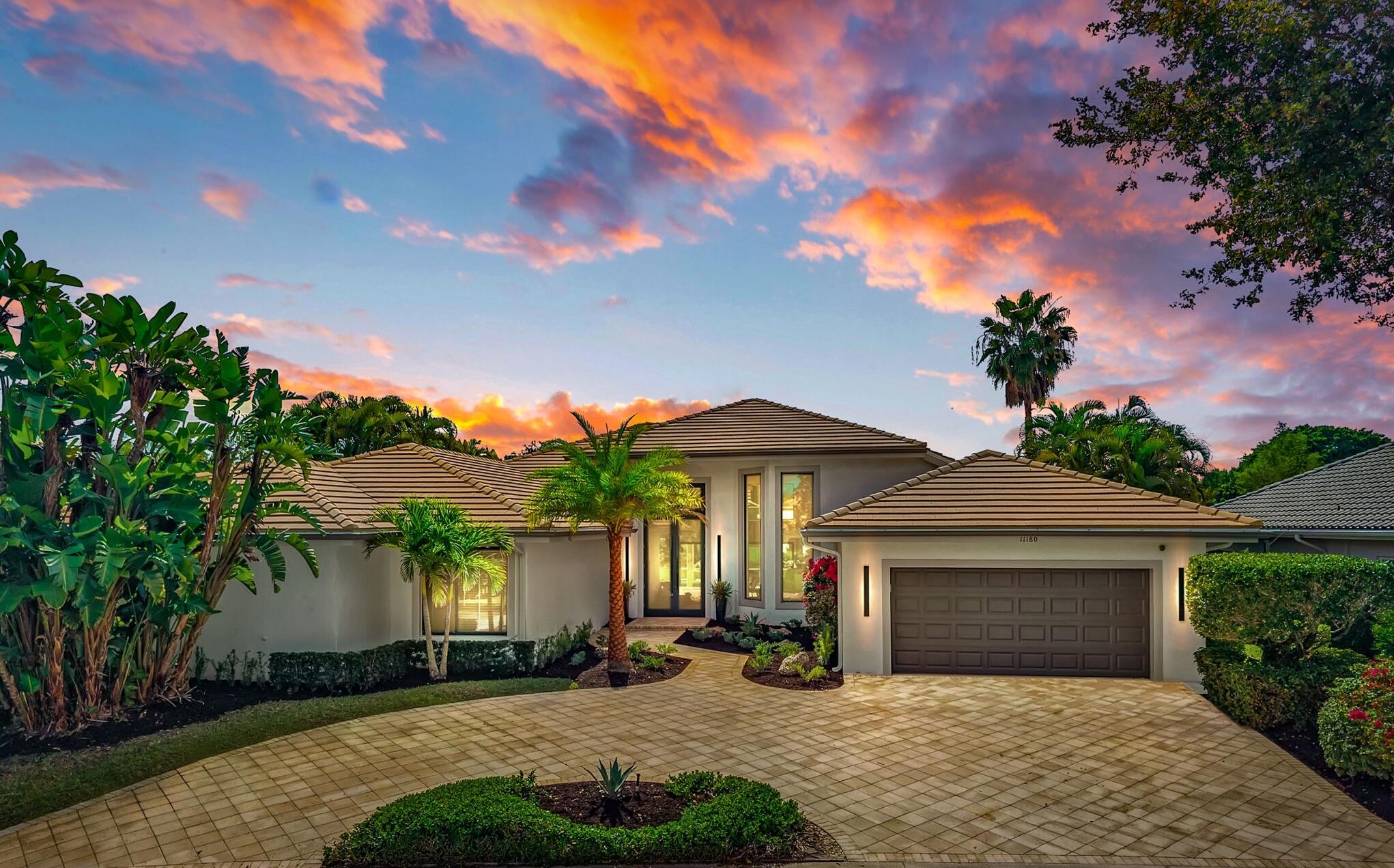 Exquisitely renovated 4BR/4BA lakefront estate in the desirable Isle Brook community of renowned Palm Beach Polo, showcasing a refined open-concept design and elevated luxury finishes throughout. Soaring cathedral ceilings and walls of impact windows bathe the interiors in natural light, complementing the rich wood flooring and expansive living spaces. The seamless flow between living, dining, and kitchen areas creates an ideal setting for both sophisticated entertaining and everyday elegance. Outdoors, a screened-in patio frames the private pool and serene lake views, offering a tranquil, resort-style retreat. Spacious bedrooms provide comfort and privacy, with exceptional potential to further customize. Ideally located near Wellington's premier equestrian venues, fine dining & shopping.