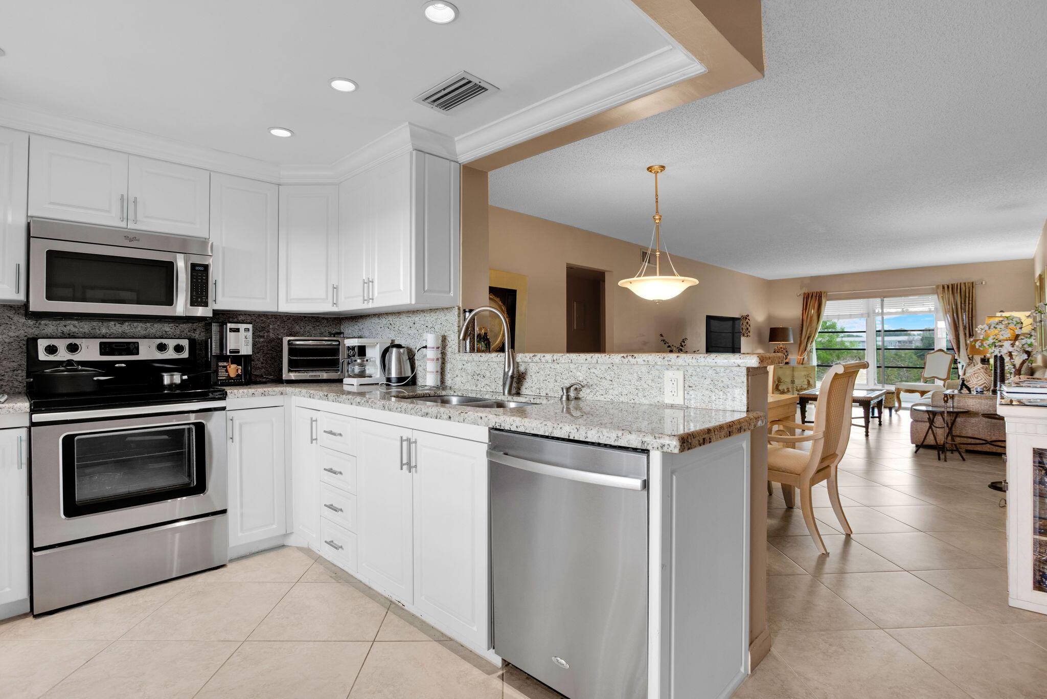 55+ updated kitchen with granite countertop, furnished turn-key, carpet only in bedrooms, tile on diagonal, glass-enclosed patio with private lake views. Roof installed in 3/2022, AC in 6/2025, water heater in 2020.  One car permitted. See all photos then see for yourself, park in #153-vacant *HEATED SWIMMING POOL*WYNMOOR COUNTRY CLUB FEATURES: IN HOUSE MOVIES & LIVE SHOWS ON SATURDAY NIGHTS WITH DANCING AFTERWARDS IN THE WEST WING OF THEATRE*18 HOLE EXECUTIVE GOLF COURSE.*TENNIS/PICKLEBALL COURTS, BOCCE COURTS, STAINED GLASS, CERAMICS, POTTERY, ART STUDIO, GLASS KILN, ZUMBA & WATER AEROBIC CLASSES, BILLIARD/POOL CENTER WITH HEATED BILLIARD TABLES, PING PONG, SAUNA, RESISTANCE WALKING POOL*SHUTTLE BUS SERVICE*OVER 90 CLUBS TO MEET NEW FRIENDS*962 THEATRE WITH DOLBE SOUND SYSTEM COFFEE SHOP REST. WYNMOOR IS LIKE A 'SLEEP AWAY CAMP FOR SENIORS" 55+.