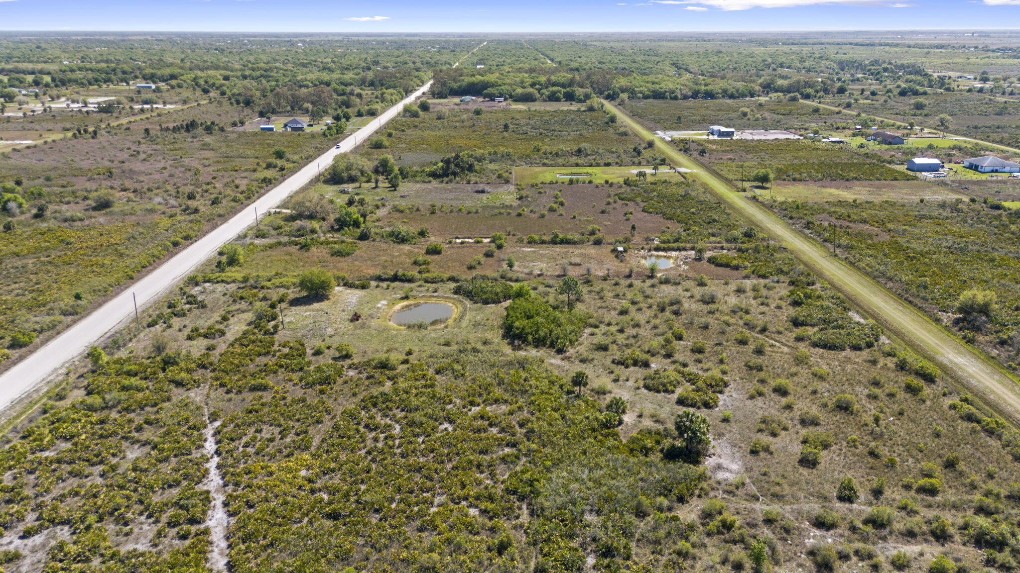 Welcome to your opportunity to own 4.5 acres in the highly desirable Viking Estates!  This unique L-shaped lot offers the perfect blend of privacy, space, and potential for your future dream home.  The property is mostly cleared and ready for development, saving you time and preparation costs. A small pond enhances the natural beauty of the land, creating a  and scenic setting ideal for relaxing or enjoying Florida's sunsets. An existing septic tank is already in place, adding convenience as you begin building.  Partially fenced, this acreage is well-suited for those looking to bring animals, create a homestead, or simply enjoy wide-open space. With plenty of room for a custom home, workshop, gardens, or recreational use, the possibilities