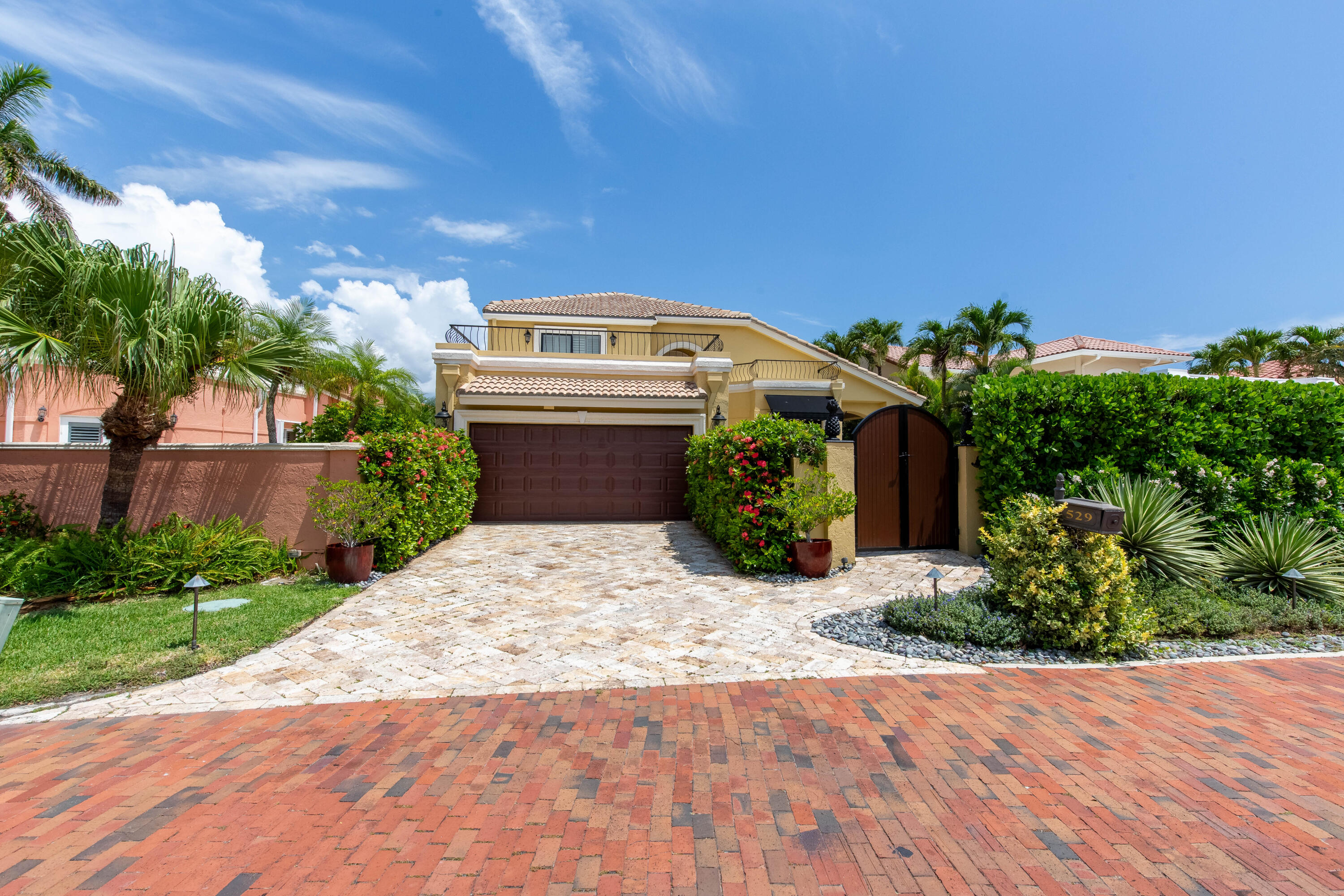 Rarely available in Pelican Harbor, 529 Pelican Way presents an exceptional opportunity to own a Mediterranean-style waterfront residence with two adjacent deeded 60 foot boat slips—an incredibly scarce offering in one of Delray Beach's desirable waterfront guard-gated communities.  This 4-bedroom, 3-bathroom home features spacious living areas, abundant natural light, a private pool, and a 2-car garage, creating the perfect setting for both everyday living and entertaining. Designed to embrace the South Florida lifestyle, the property offers seamless access to boating, waterfront recreation, and the relaxed elegance that defines life in Delray Beach. The true centerpiece of this offering is the pair of adjacent boat slips, providing the flexibility to accommodate multiple vessels and offering direct access to the Intracoastal Waterway and Atlantic Ocean. Opportunities to purchase a home with two side-by-side slips in a gated waterfront community are exceptionally rare.  Residents of Pelican Harbor enjoy a host of resort-style amenities, including a marina, clubhouse, fitness center, tennis and pickleball courts, all just minutes from Atlantic Avenue's renowned restaurants, boutiques, entertainment, and pristine beaches.  Whether you're a serious boater, seasonal resident, or year-round homeowner, 529 Pelican Way offers a unique combination of waterfront living, gated security, and an unmatched boating lifestyle in the heart of Delray Beach.