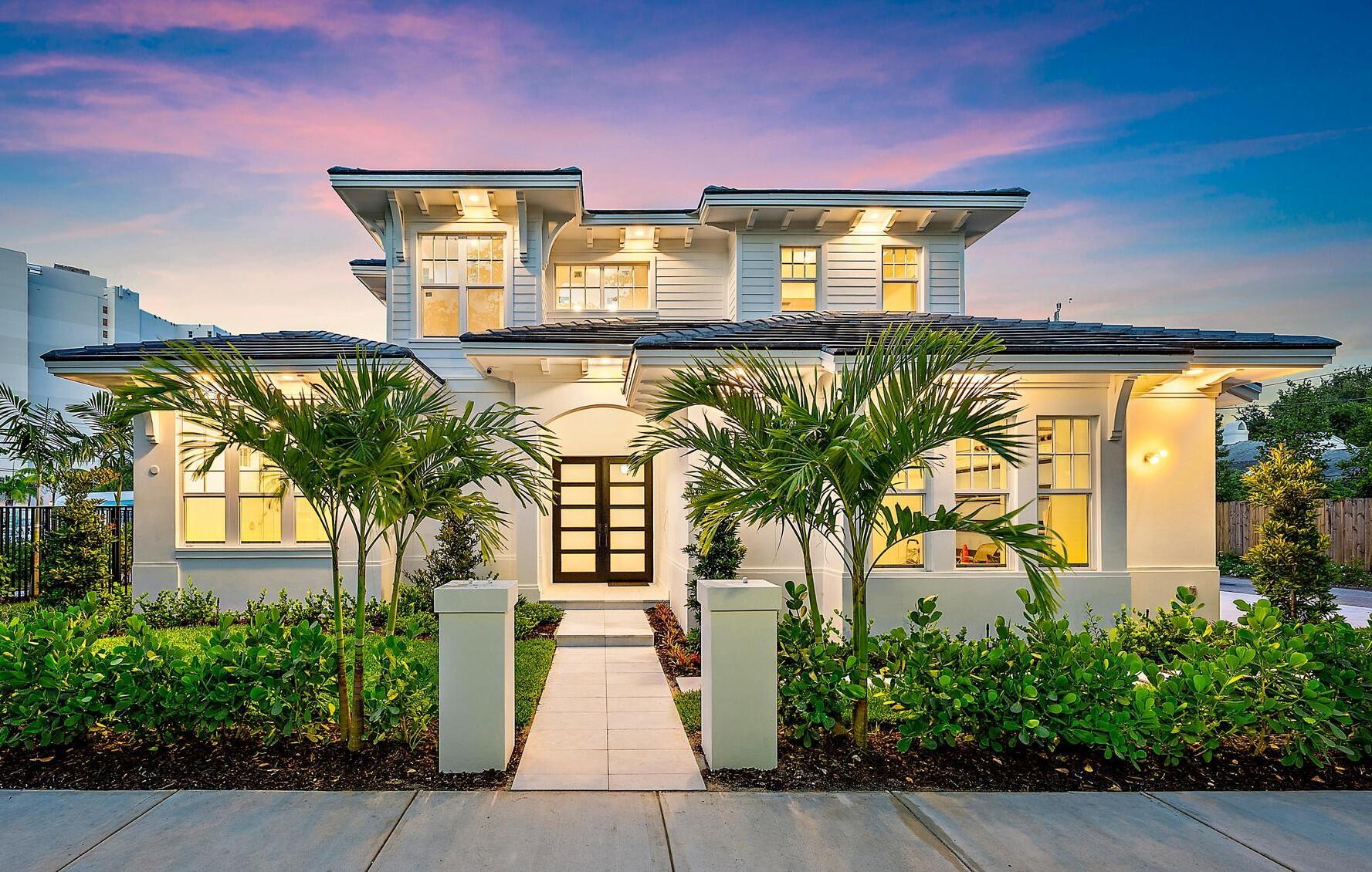 Welcome to 295 Austin Lane, a picturesque new build designed by architect Kelly Yates, this West Indies inspired coastal modern residence captures the spirit of the Mango Promenade Historic District, marrying timeless architecture with a sophisticated yet welcoming aesthetic. With four bedrooms and four and a half bathrooms, highlights include elevated finishes, handsome engineered hardwood flooring, impact-rated windows and doors, and high ceilings with inset lighting. In a light-filled open floor plan expertly executed for today's Florida living, the great room features a custom wet-bar and a wall of sliding doors that open to the pool-view patio. Just adjacent are the dining room and island kitchen, which is appointed with Shaker-style wood cabinetry, quartz counters, gas range and high-end Dacor and Fisher & Paykel appliances. Placed on the first-floor for effortless living and optimal privacy, the primary suite accesses the pool loggia. The suite comprises two walk-in closets and a spa-like porcelain-finished bathroom with dual sinks in a custom vanity, free-standing soaking tub, multi-head double shower with bench seating, and a Smart toilet. Upstairs, the loft connects three tree-top-view guest bedroom suites. Completing the layout are a powder room and laundries on both floors. Amenities include a 2 car garage with epoxy flooring, on-demand tankless hot-water heaters, full-house generator, state-of the art smart home technology with mobile support, and a sophisticated security/surveillance system with 14 cameras, lights and siren. Thoughtfully conceived and beautifully executed, this modern class redefines luxury living.

The residence is surrounded by fenced designer gardens with 26 new trees, a 3-car marble paved driveway and a private backyard oasis with a 26 foot salt chlorinated gas-heated swimming pool with a sun shelf and a 4 jet spa shelf set within an expansive marble-paver patio, edged with a green-carpeted lawn and pocket gardens.

295 Austin Lane is located within the coveted Palm Beach Public school zone one block from the Flagler Drive waterfront within Matthams Park in Mango Promenade, a prestigious West Palm Beach historic district originally platted in the early 1900s that evokes the allure and elegance of Old Florida. Ideally positioned just north of the celebrated El Cid Historic District, it lies at the gateway of Palm Beach, within moments to Palm Beach Island's pristine ocean, world-class shopping and fine-dining venues. Born as an adjunct to affluence, West Palm Beach has grown to become one of the three main cities in Florida and a regional center for commerce. Today it is home to historic and scenic neighborhoods, breathtaking waterfront views, eclectic shopping and dining districts, the Green Market, Kravis Center for The Performing Arts, the Norton Museum of Art, Grassy Waters Everglades Preserve, and Palm Beach International airport.

DISCLAIMER: Information published or otherwise provided by the listing company and its representatives including but not limited to prices, measurements, square footages, lot sizes, calculations, statistics, and videos are deemed reliable but are not guaranteed and are subject to errors, omissions or changes without notice. All such information should be independently verified by any prospective purchaser or seller. Parties should perform their own due diligence to verify such information prior to a sale or listing. Listing company expressly disclaims any warranty or representation regarding such information. Prices published are either list price, sold price, and/or last asking price. The listing company participates in the Multiple Listing Service and IDX. The properties published as listed and sold are not necessarily exclusive to listing company and may be listed or have sold with other members of the Multiple Listing Service. Transactions where listing company represented both buyers and sellers are calculated as two sales. "No payments made until title passes" Some affiliations may not be applicable to certain geographic areas. If your property is currently listed with another broker, please disregard any solicitation for services. Information published or otherwise provided by seller, listing company or its representatives is deemed reliable but are not guaranteed and subject to errors, omissions, or changes without notice. Copyright 2025 by the listing company. All Rights Reserved.