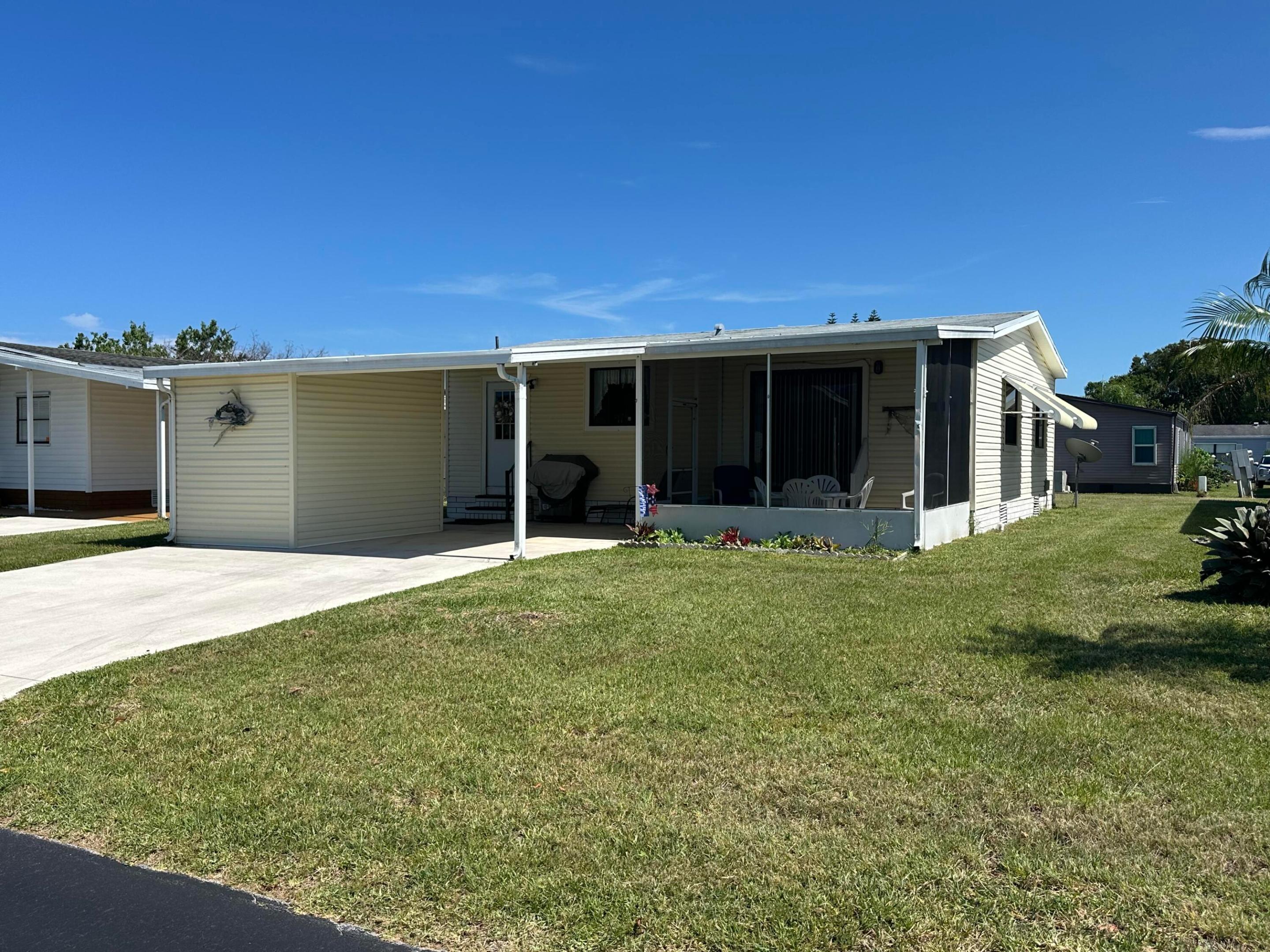 Cute as a button 2 bedroom 2 bath home with nearly new roof on it and inexpensive lot rent of $594 per month.  Attached shed and screened lanai make this the perfect affordable Florida living place for you.  All sizes, measurements and information is approximate and to be verified by the buyer.