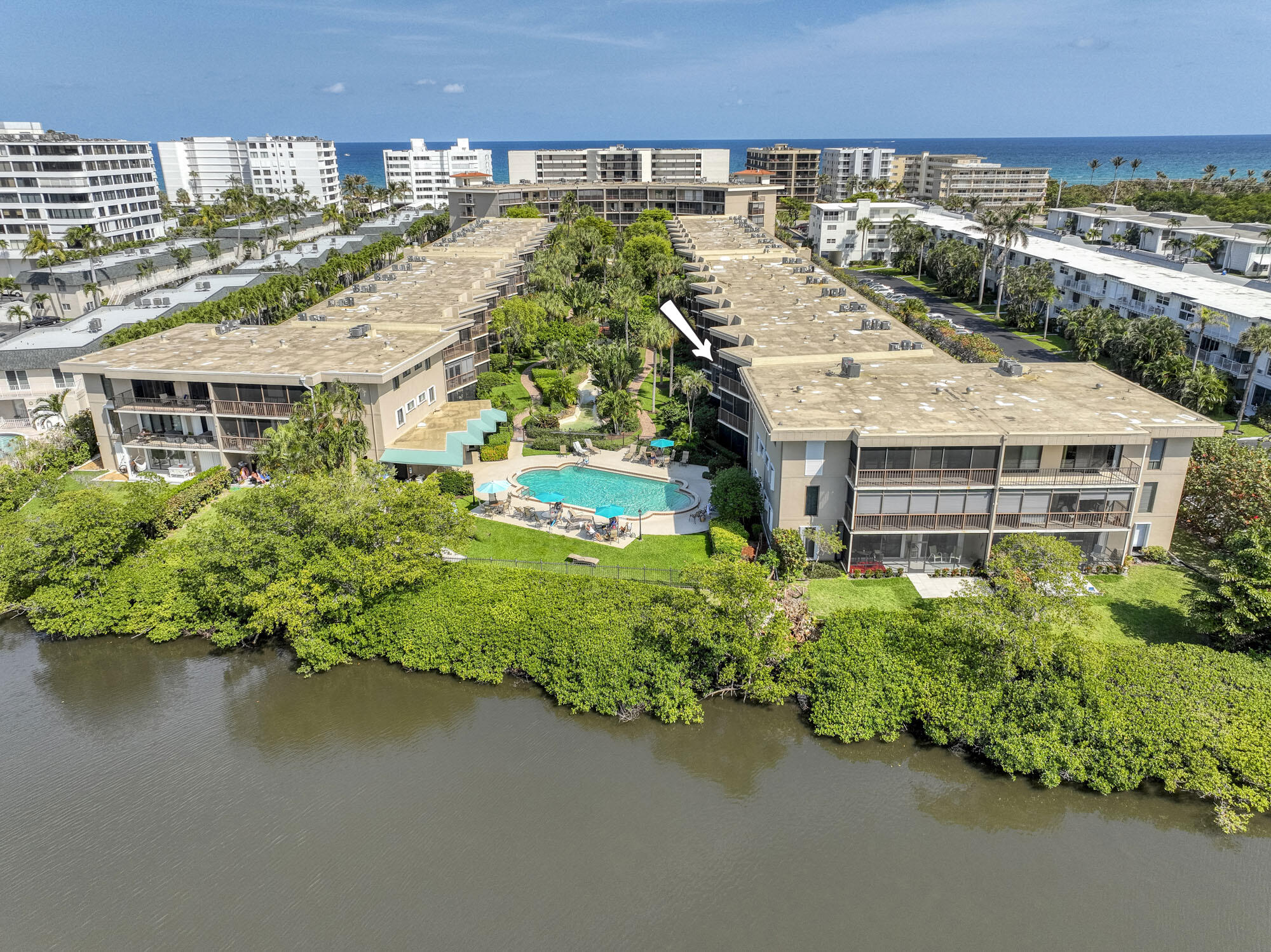 INTRACOASTAL VIEWS await in this stunning 2/2 waterfront condo, fully furnished for seasonal or off-seasonal rentals. The kitchen has white cabinetry, granite countertops, and stainless steel appliances. A spacious living room flows seamlessly to a large balcony, offering breathtaking views of the intracoastal ,pool and lush landscaping. Split bedroom floor plan includes a generous master suite with an ensuite bath, ample storage, plantation shutters, impact windows and doors, plus an in-unit washer and dryer. This peaceful oasis features a serene walkway to the heated pool and sauna, all overlooking the tranquil intracoastal. Perfectly located near Lantana's best amenities, including Palm Beach Island, the Four Seasons, and The Au Palm Beach Resort. Enjoy coastal living just steps from the ocean.
