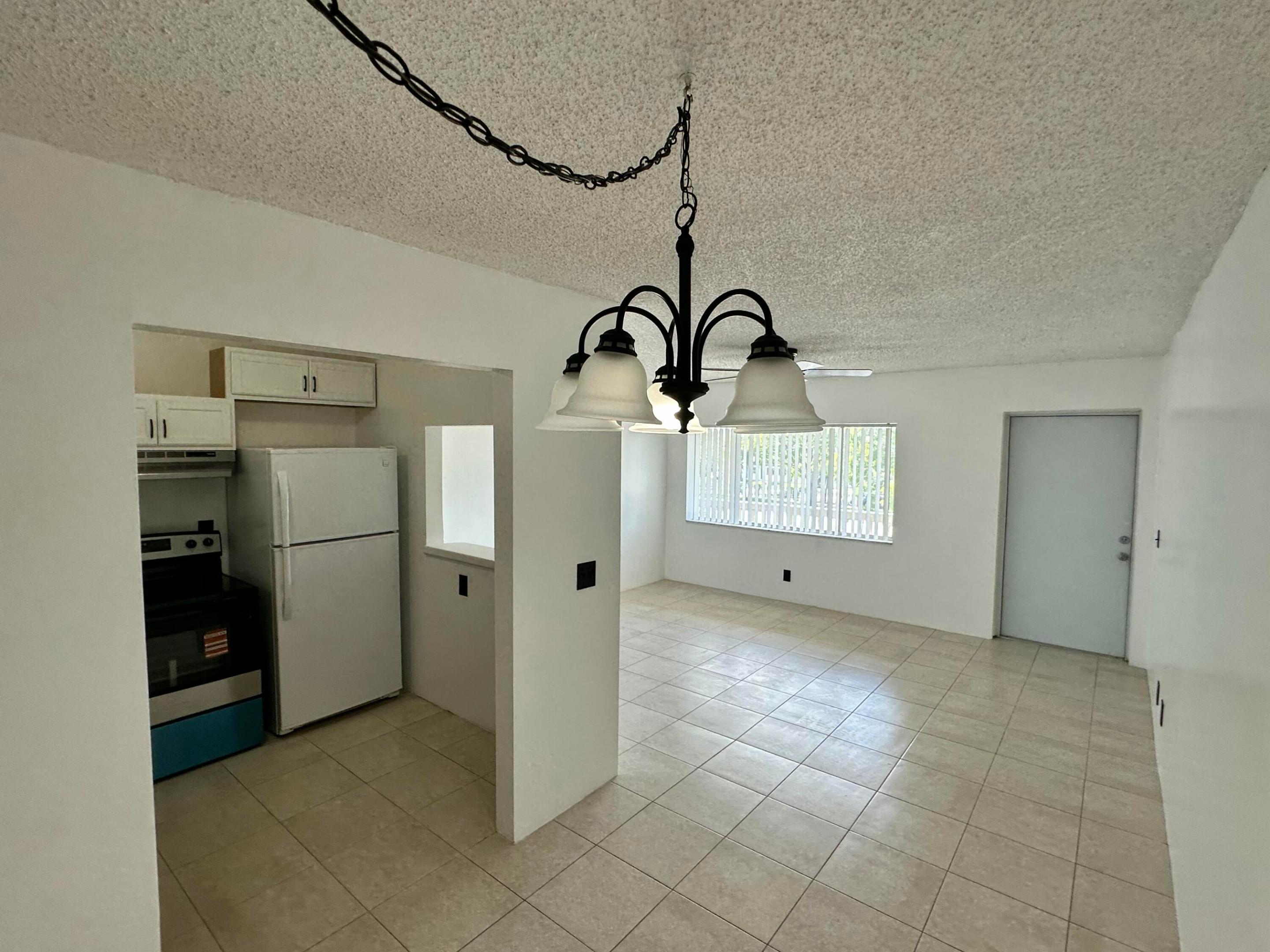 **PLEASE NOTE YOU MUST BE AT LEAST 55 YEARS OLD TO LIVE HERE** This is a 55+ COMMUNITY Welcome to this charming one-bedroom, one-bathroom condominium located in Village Green Avon Condo in Palm Springs, Florida. This efficiently designed unit offers 650 square feet of finished living space across three floors, providing functional room distribution and smart use of space. The property's layout makes it an excellent choice for those seeking a manageable residence in a well-established community.