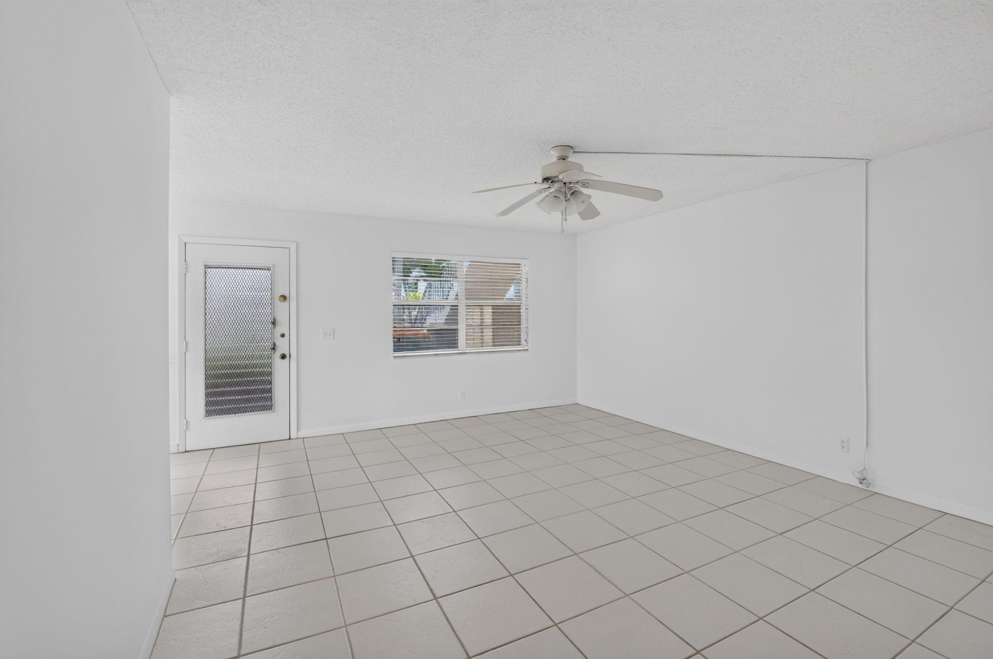 Welcome to easy Florida living in this beautifully updated 2-bedroom, 2-bath first-floor condo! Enjoy a renovated kitchen featuring granite countertops, fresh interior paint, and a spacious enclosed lanai with new flooring overlooking a private lot with no rear neighbors.  Located in a vibrant 55+ active adult community, residents enjoy an incredible array of amenities including a public golf course, resort-style pools, fitness center, salon, café, tennis and pickleball courts, and a state-of-the-art theater featuring live shows and entertainment. Whether you're seeking an active lifestyle or a peaceful retreat, this home offers the perfect combination of comfort, convenience, and recreation.