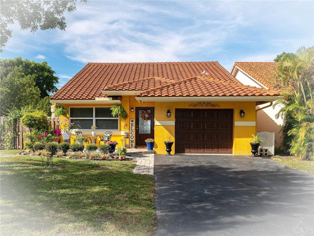 WATCH THE SLIDESHOW. Great Opportunity to start the year. Prime location in the heart of Coral Springs. Wonderful schools & easy access to the many downtown shops, cafes, restaurants and so much more! This beautiful home is situated on a large corner lot and features a 1.5-car garage, a big driveway, and a hidden storage closet on the side of the house. There is a spacious fenced and very private backyard and a screened patio off the family room. The roof was replaced in 2006, the AC is just 3 years old, the tankless water heater is newer and most important you have hurricane-rated impact windows & doors throughout. Inside features include volume ceilings, updated bathrooms, SS appliances, new interior doors, and the list goes on. Remember, there is NO HOA and no rental or pet restrictions