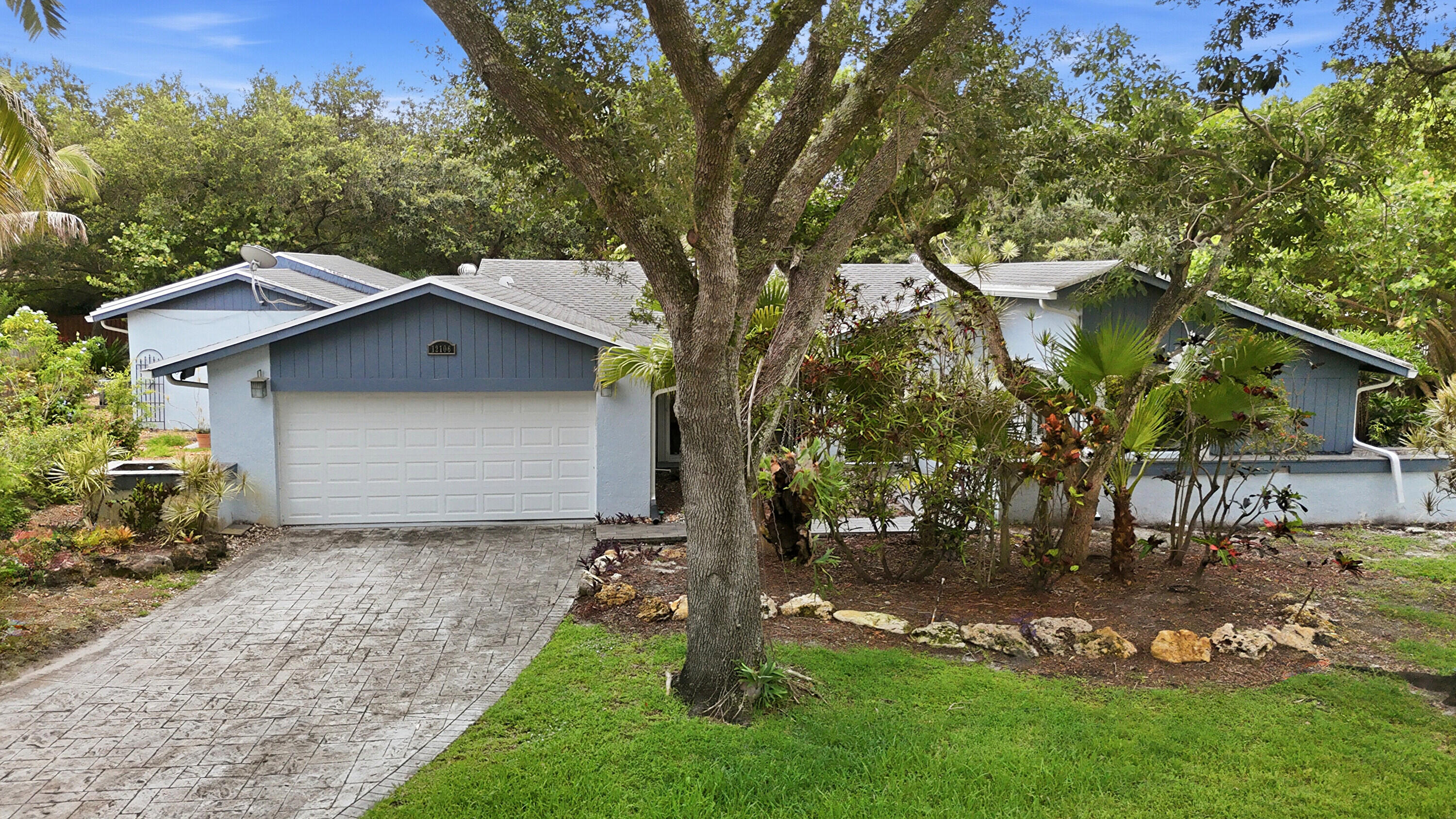Beautiful home in Cooper City's prestigious Rock Creek neighborhood! This picture-perfect house is situated on a cul-de-sac and is tucked away in a tranquil woodland setting. Roof was replaced in 2018, accordion HURRICANE SHUTTERS, 3 bedrooms/3 bathroom, remodeled,  kitchen with wood cabinets, stainless steel appliances, granite countertops, Tile throughout.  An oversized living room, formal dining room, and family room, custom built-in entertainment center.  "In-laws quarters" qualifies as a 4th bedroom with a wet bar and private bathroom. HUGE screened-in patio and pool that can be accessed from the master bedroom, family room, and "In-laws quarters." Larger lot. Beautiful green area behind the property compliments this tranquil backyard.  Electrical panels updated in 2023.