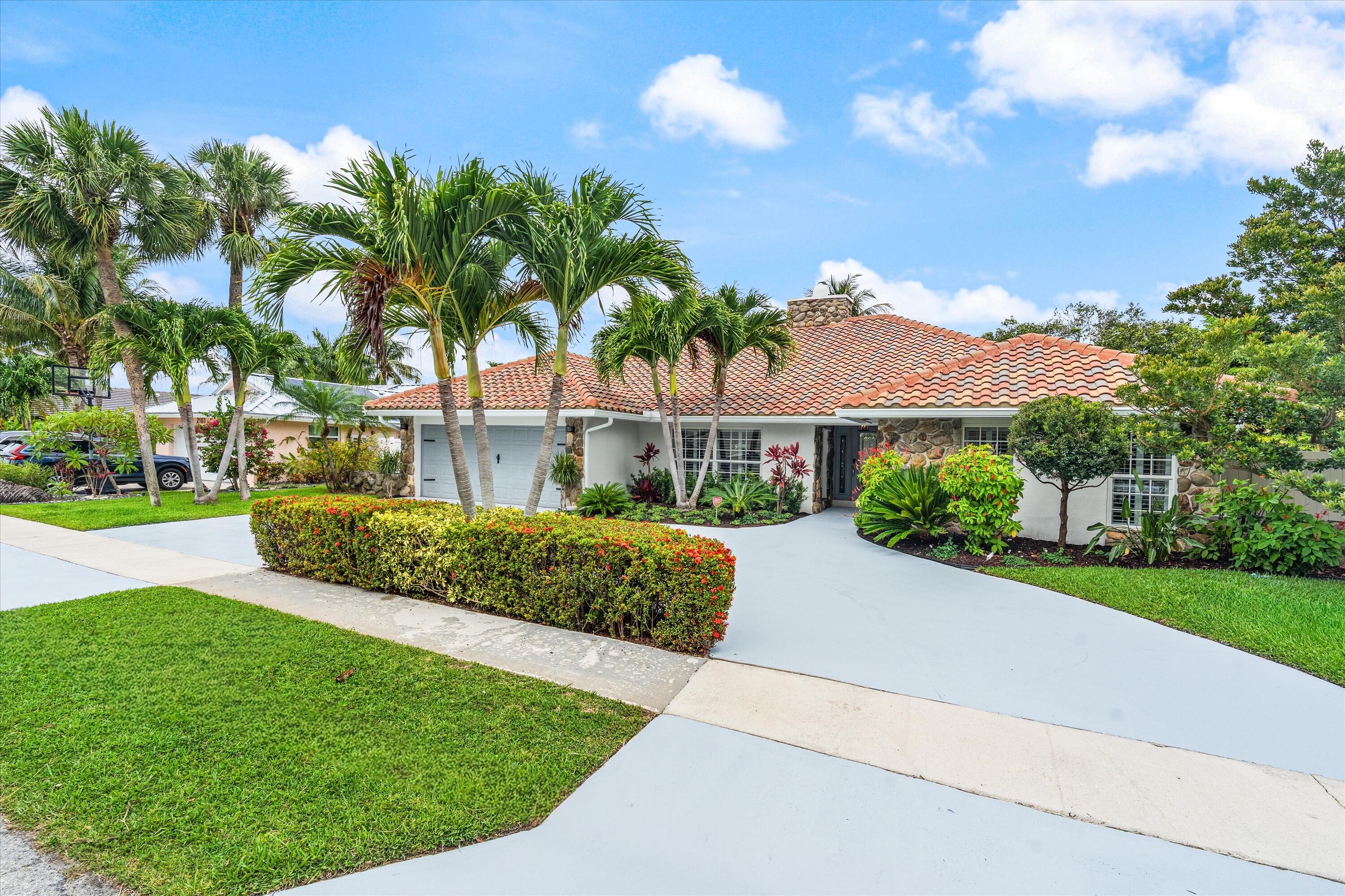 Rare opportunity in the coveted Camino Lakes neighborhood of East Boca Raton. This impeccably renovated 1-story, 3BD/2BA, 2,872 sq ft residence has been transformed with no expense spared — marble floors, a custom onyx lighted bar, designer built-ins throughout, and a dramatic wood-burning fireplace as the living room centerpiece. The chef's kitchen features new Samsung Bespoke appliances. The spa-caliber primary suite offers his-and-hers walk-in closets, separate vanities, a soaking tub, and a frameless shower with BRIZO fixtures. Smart-home ready with Lutron Caséta lighting automation and Nick Alan designer fixtures throughout. Outdoors: travertine pavers, full perimeter turf, and a custom pool with a new pump. All major systems updated: tile roof (2019), dual-zone A/C and heater (2019), new W/D. Freshly painted inside and out. Ultra-low HOA ($200/yr) in a family-friendly community with top-rated schools (Addison Mizner, Boca High). Under 2 miles to the ocean; 5 min to Mizner Park. Offered at $1,875,000. This is the turnkey Boca lifestyle delivered at the highest level — nothing to do but move in.