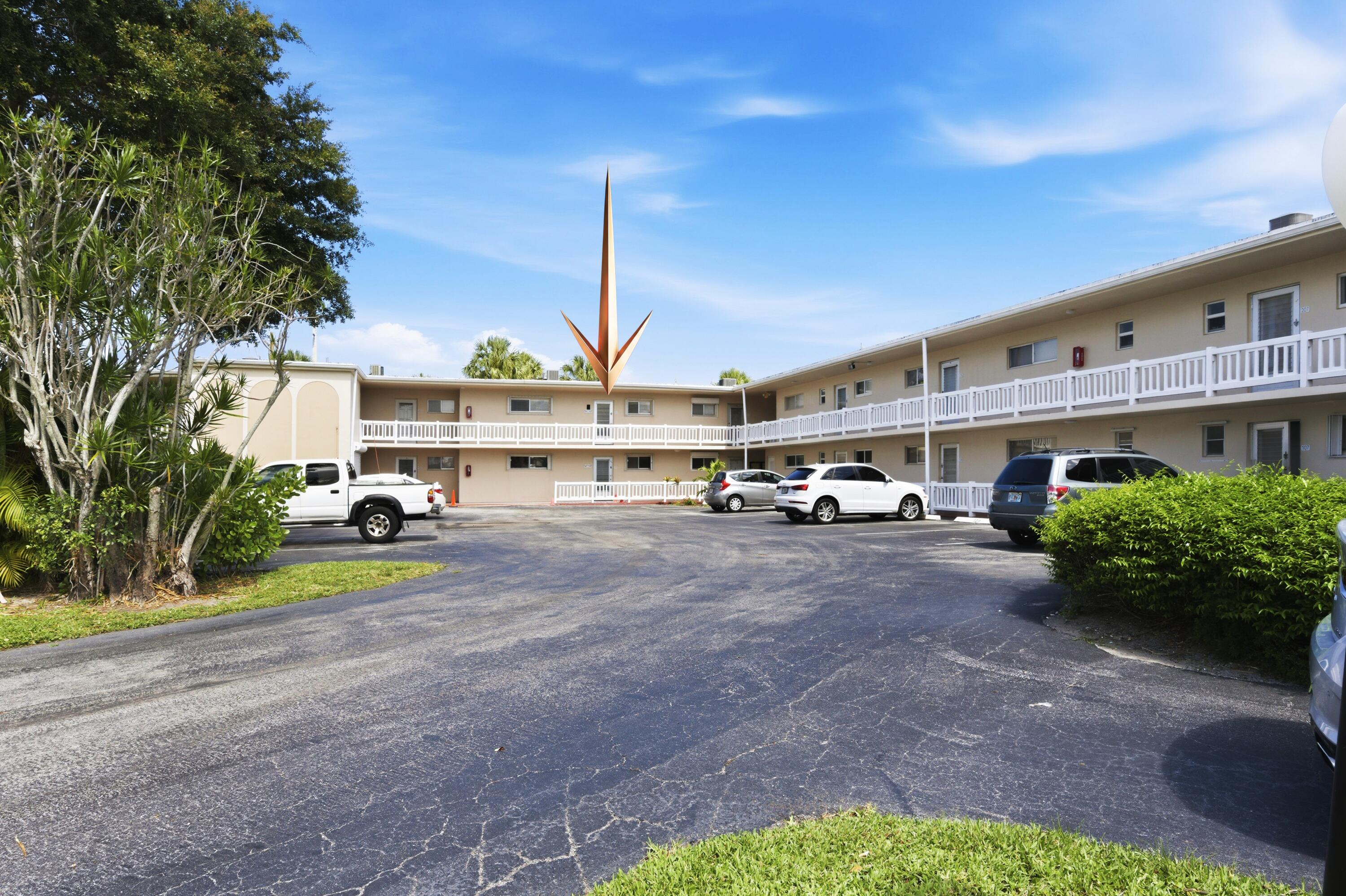 This beautifully maintained second floor, 2-bedroom, 1-bath condo offers comfort, style, and peace of mind with thoughtful updates throughout. Features include updated tile flooring, a new electrical panel, and a fully renovated bathroom with contemporary finishes. Relax on the covered, enclosed balcony overlooking a serene garden setting, perfect for enjoying morning coffee or evening tea with cool coastal breezes. Accordion and roll-down shutters provide added storm protection. Located in a vibrant active adult community with resort-style amenities including a clubhouse, pools, saunas, fitness center, library, and more. Maintenance includes cable and internet. Minutes from the area's most pristine beaches, fine dining, shopping, and PBIA.