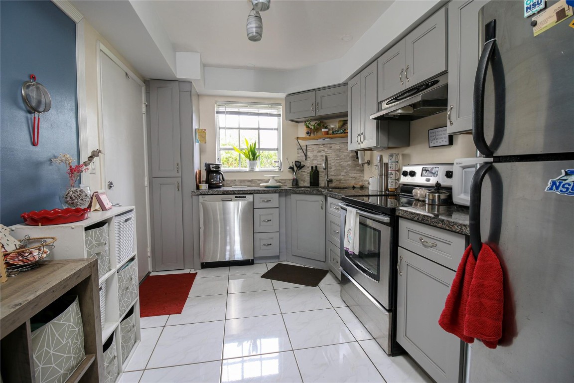 Briarwood Club in the heart of Coral Springs, tucked behind Village on the Green. Enjoy sunrises over a green backyard and canal, and sunsets from your updated kitchen. This upgraded 2-bed, 2-bath end-unit features granite countertops, modern cabinets, backsplash, ceramic tile and vinyl floors, upgraded ceilings, a spacious master suite with closets, and a new hot water heater. Enjoy a private screened lanai with backyard access and scenic windows throughout. Community includes a pool, clubhouse, dog walk, and laundry. Walk to City Hall events, The Walk, Trader Joe’s, and shops. SIRS compliant. NEW ROOF INSTALLED AND A BRAND NEW A/C UNIT! NEW HOT WATER HEATER!