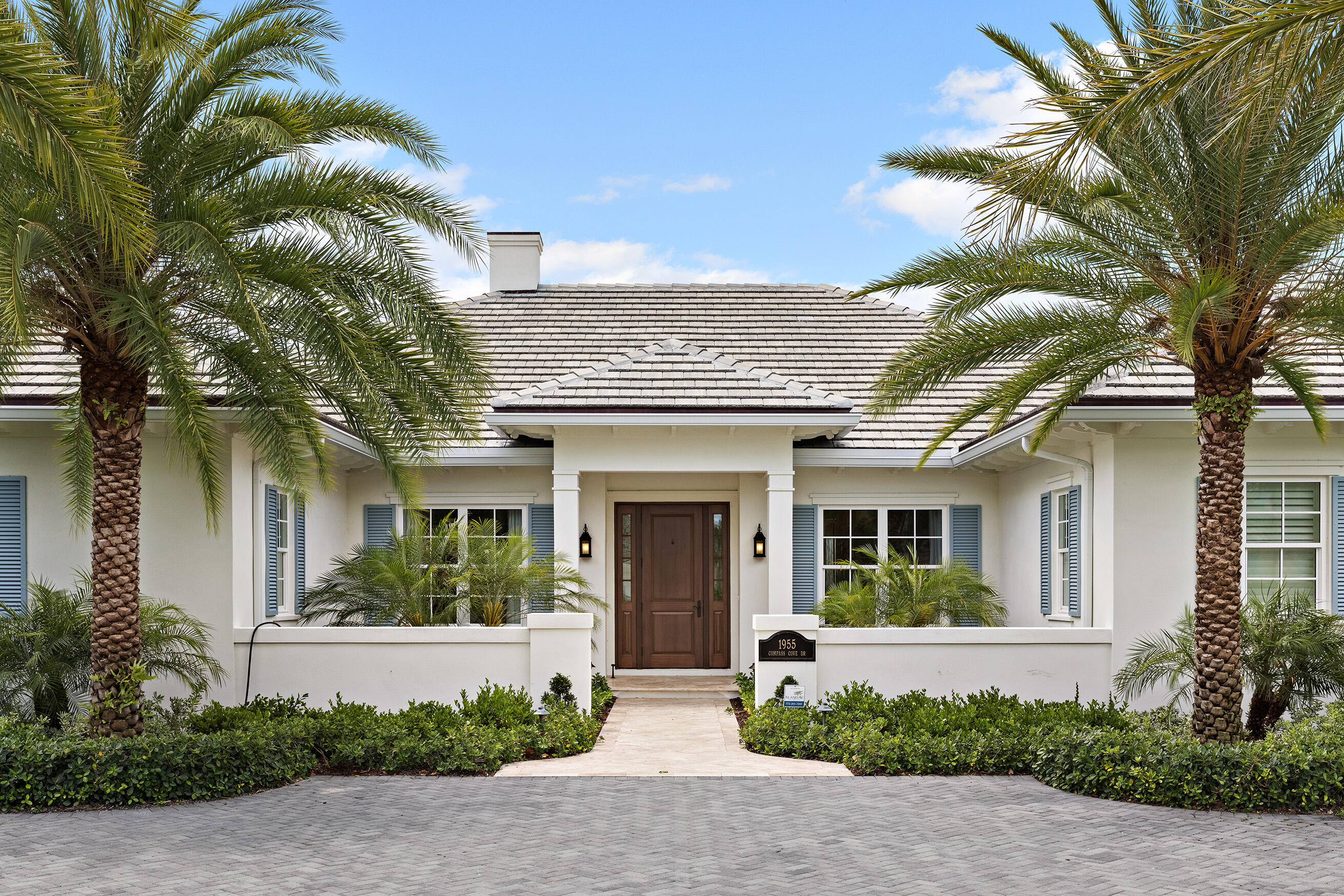 Manicured palms shade the entryway of this magnificent single-story Vero Beach waterfront home, custom built and completed in 2020. 

The high ceilings and open concept layout showcase the spectacular natural setting through a cascade of large windows and glass paned French doors. Wide-plank hardwood floors are found throughout this beautiful home along with the convenience of five ensuite baths and two potential home offices.

Even the most discerning chef will find a lot to love in this home's gleaming gourmet kitchen, fitted with state-of-the-art Wolf and Sub Zero appliances. Its oversized island has a farmhouse-style sink, generous counter space, and in-cabinet illumination to find what you need with ease. The primary bedroom features his-and-hers walk-in closets, double vanity, freestanding soaking tub, and easy access to a delightful exterior patio and spa. An entire wall of windows offers spectacular water views and of the lushly landscaped gardens. 

Watch passing boats from the comfort of your sizable lanai, or bask in the abundant sunshine by the southern facing infinity pool. Down at the water's edge, you'll find your private dock with two boat lifts and private sea life viewings. 

Located a short distance off of A1A, with deeded beach access, and close to the Moorings Yacht and Country Club with an expansive golf course. 

A tour of this marvelous coastal retreat will leave you in awe of the dream life that awaits you!