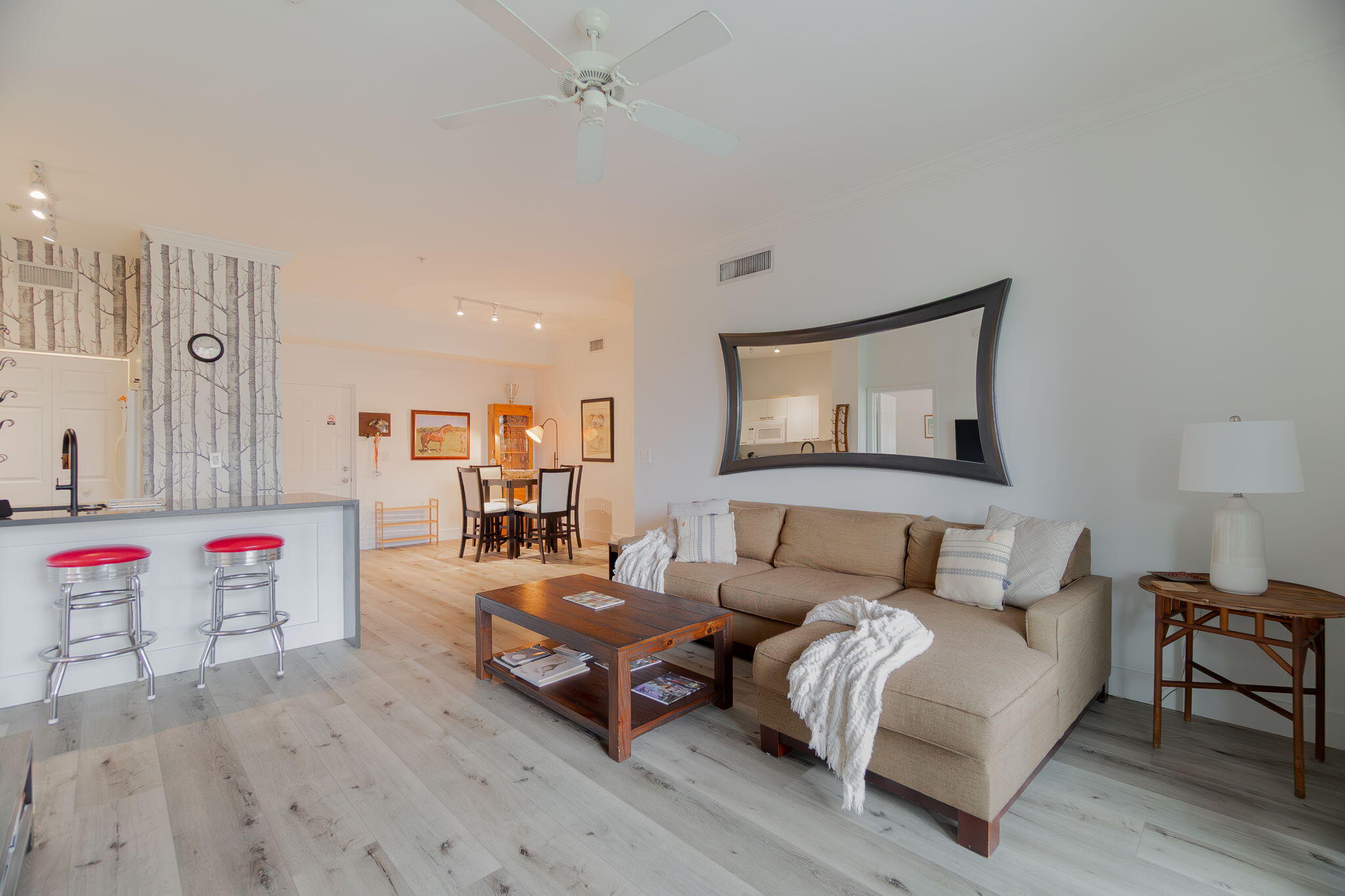 Rarely available condo with a private one-car garage in the sought-after Saint Andrews at the Polo Club! This beautifully renovated 2-bedroom, 2-bathroom residence features two spacious primary suites, each with its own private bathroom, offering comfort and privacy for owners and guests alike. Filled with natural light, the open-concept floor plan showcases soaring ceilings, a spacious living and dining area, and a private screened balcony perfect for relaxing and enjoying the Florida lifestyle. The well-appointed kitchen offers ample cabinetry and counter space, while both bedrooms provide generous closet storage. The dettached one-car garage offers added convenience and valuable extra storage, a feature not commonly found in many units within the community.  Residents of Saint Andrews enjoy an exceptional resort-style lifestyle with a swimming pool, fitness center, tennis courts, indoor racquetball court, clubhouse, and gated entry, all within one of Wellington's most desirable communities.