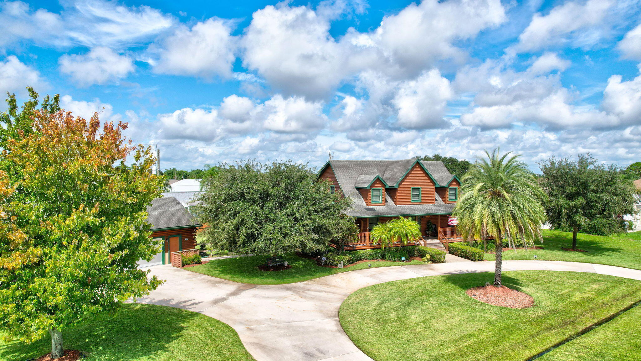 Gorgeous log home with a pool! No HOA. Fully fenced double lot. Detached 3 car garage. Custom Southland built home with borage treated Kiln dried sterilized logs. The home features an open floor plan on the first floor that offers a bonus room that could be a 4th bedroom, 2 full and 2 half baths, salt water pool (2017), hot tub, all wood and tile flooring, fireplace, stainless appliances, walk in pantry, granite counters in the kitchen and baths, real wood cabinets. Master bedroom on main level and two bedrooms upstairs with a large loft area. AC less than a year old. 3 car detached air conditioned garage. Gravel side area beside the garage is perfect for a boat or RV. Circular driveway for plenty of parking. No HOA, bring all the toys. Centrally located to shopping, dining, Tradition.