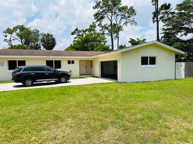 4/2 Single family house with 2 car garage. Great location for use as home office or your construction or landscaping business. Recently Updated. 1.35 acres lot gives plenty of serenity and privacy. Huge long extended roadway from the street to the house. Park and store your boats, trucks, trailers. Huge playing field for the kids. All windows and doors are hurricane impact. Double size rear patio for your BBQ party. Separate breakfast nook, Formal dinning/ family room and separate living room. Split bedrooms. Enjoy the huge lot with room to roam around. AC is only 2 years old. Well Water filtration system is included. No water or sewer bills. Don't miss this run your home business from here. Ready to move in. No association. Sec-8 welcome. Min credit score needed. Great commercial Great deal for Commercial or small business owner to use it home office, park your boats, trucks, equipment. Many possibilities. To rent out the entire property and to use as home office or your construction or landscaping business