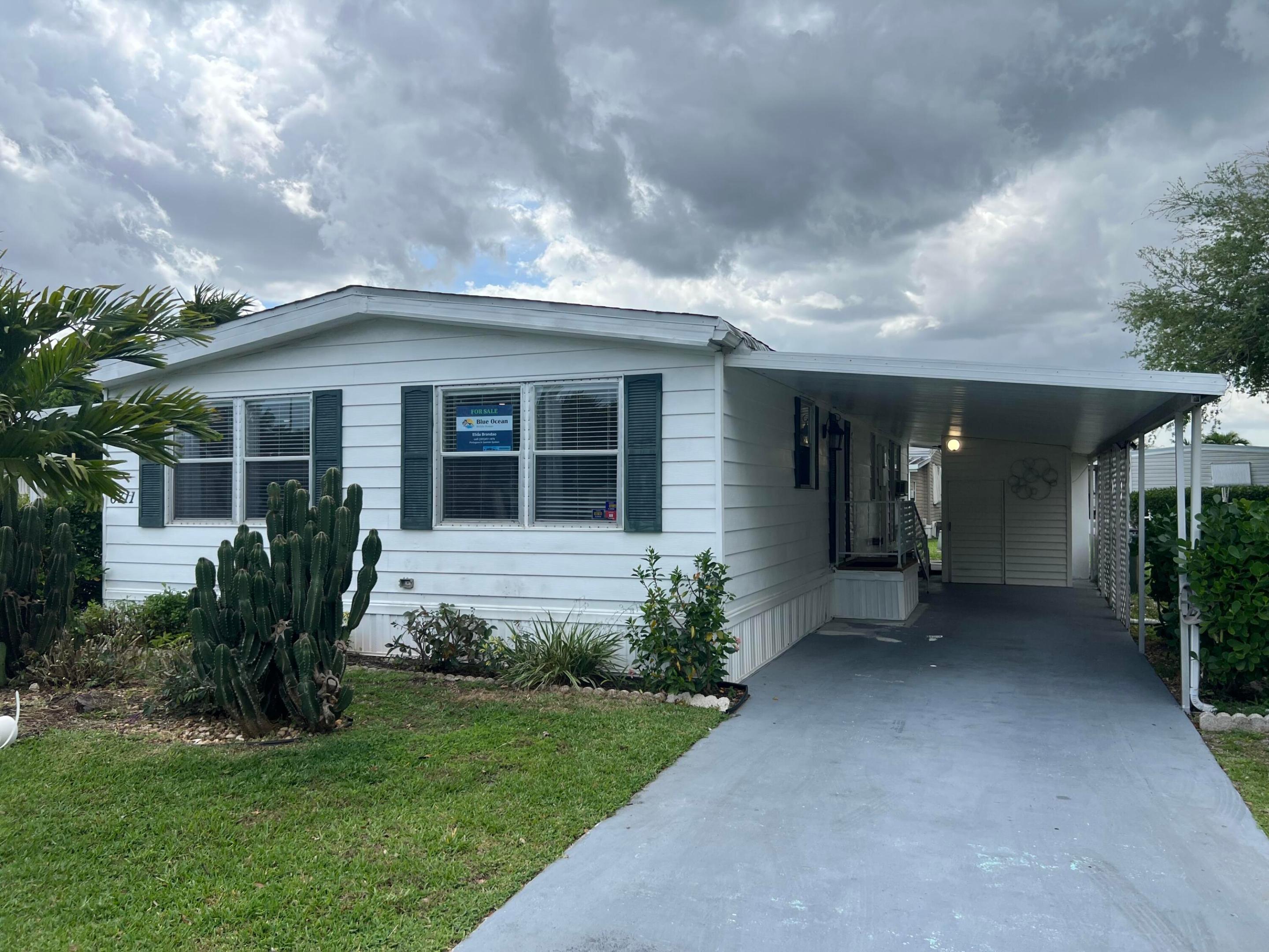 LOCATION, LOCATION, LOCATION! DON'T MISS THIS OPPORTUNITY. THIS IS A 3/3 LOCATED IN A 55+ GATED COMMUNITY. TOTALLY REMODELED: NEW FLOOR, NEW ELECTRICAL SYSTEM. THE KITCHEN IS OPEN THROUGH WITH A LAMINATE COUNTER TOP THAT CAN BE SEATED 6 PEOPLE, NEW STAINLESS STEEL APPLIANCES. NEW CABINETS.A NEW STUDIO ATTACHED AND IT CAN BE RENTED UPON APPROVAL. THE LOT RENTAL IS $1,160.00 PER MONTH WHICH INCLUDES TRASH REMOVAL, WATER, LANDSCAPING,TAXES AND PEST CONTROL. THE CLUB HOUSE OFFERS LOTS OF ACTIVITIES AND CLOSED TO ALL MAJOR HIGHWAYS, HOSPITALS, SHOPPING, AND RESTAURANTS. SELLER IS OFFERING TO PAY SIX(6) MONTHS OF LOT RENTAL. DO NOT MISS THIS OPPORTUNITY, IT WON'T LAST TOO LONG!