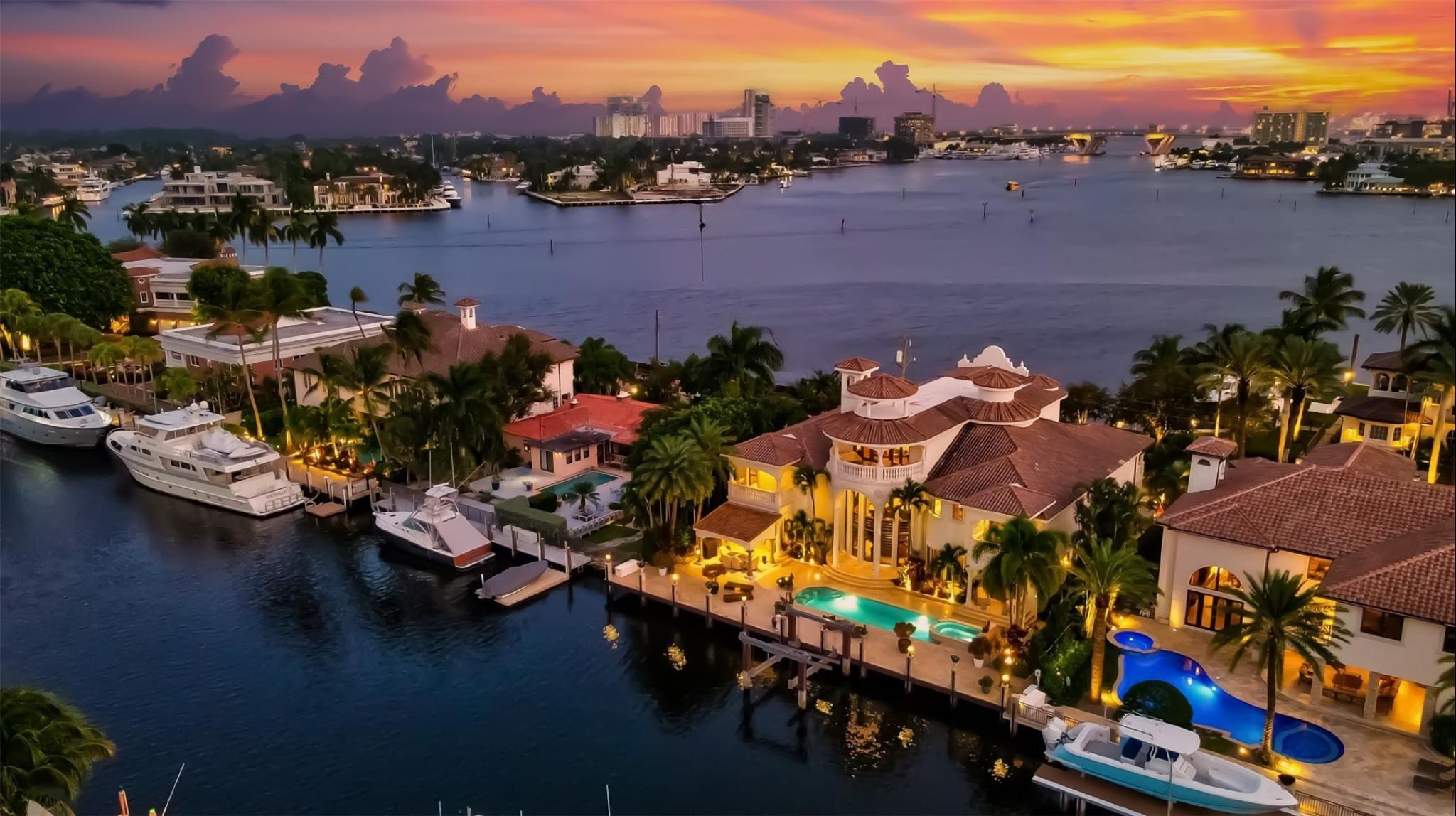 Located on one of Rio Vista’s finest isles! Uniquely offering one of the best wide open intracoastal views to the front of the residence plus 100 feet of deepwater frontage on 120 ft canal.  Almost every room features a view!  Totaling almost 11,000 sf this extraordinary custom residence showcases 3 levels of immaculately presented luxury living. Easy flowing formal & casual entertaining areas surround the gourmet kitchen.  1st level includes formal dining, fireplace, media room, waterfacing office & large VIP suite.  Elevator access to 2nd level ultra luxurious primary wing, sitting area & private balcony, large additional VIP suite, all expansive bedroom suites. 3rd level Club Room (or 6th bedroom) offers double balconies, amazing views & elevator access. Must be seen to be appreciated!