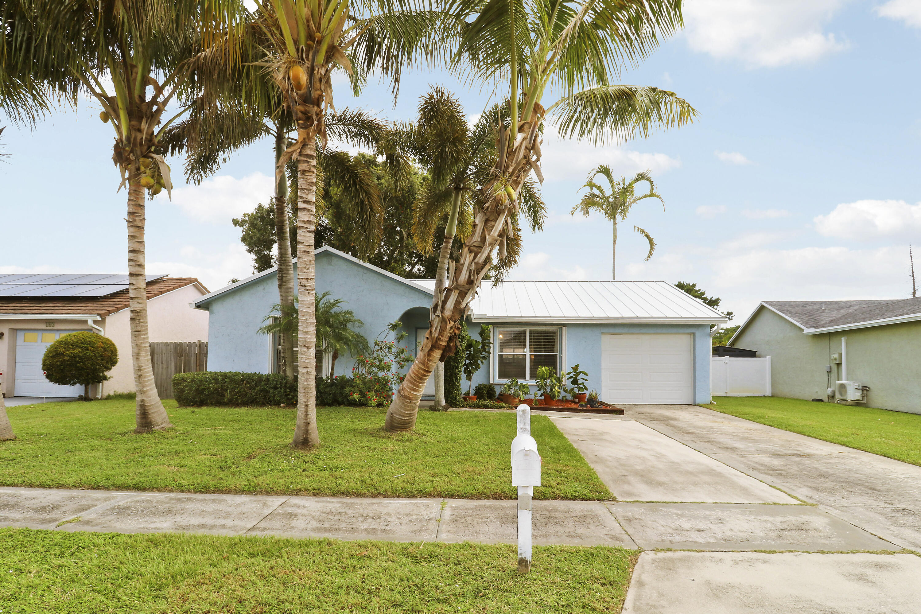 Welcome home to Jupiter Village! This pristine home offers ultimate peace of mind with major system updates: 2026 roof, 2022 Central A/C & new ductwork, 2022 electrical panel, 2023 gutters, and a 2021 garage door. The entire home is protected by complete accordion hurricane shutters. Inside, enjoy a functional single-story layout, bright living spaces, an updated kitchen, and a primary suite featuring its own 2024 mini-split for custom climate control. Step outside to a private fully-fenced backyard with an expansive paver patio. Bonus feature: A gated side-yard parking area built for your boat, trailer, or toys! Located in desirable Jupiter Village with low HOA fees, community pool, top-rated schools, and quick access to beaches, dining, and major highways. Schedule your tour today!