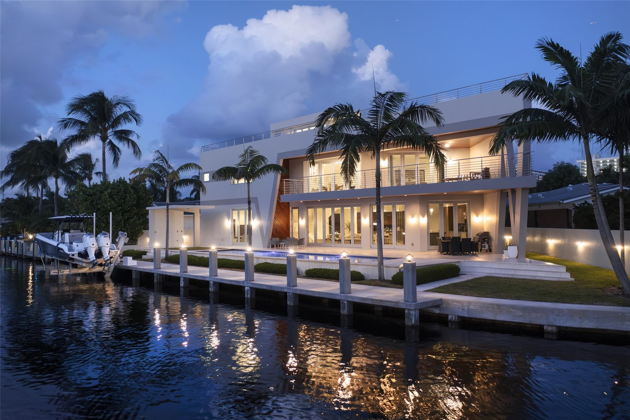 HIGHTLIGHTS: DIRECT INTRACOASTAL VIEWS FROM SEVERAL ROOMS & EXTERIOR | SOLID CONCRETE CONSTRUCTION | IMPACT GLASS | 48K GENERATOR | ELEVATOR TO ALL 3-LEVELS | 50± FT HEATED POOL | SHORT WALK TO THE BEACH. YACHTSMEN: 135± DEEPWATER FRONTAGE | FITS 80-90± FT YACHT AT CANAL TURN|BOAT LIFT. LIVING AREAS: FLOOR-TO-CEILING ACCORDIAN STYLE IMPACT GLASS DOORS | MARBLE FLOORS | INTRACOASTAL VIEWS | CABANA BATH. KITCHEN: PANTRY STORAGE | 14± FT ISLAND TOP WITH IRIDESCENT LEMURIAN BLUE GRANITE | OPENS TO COVERED OUTDOOR DINING & PATIO. PRIMARY BEDROOM SUITE: 2ND LEVEL HAS DIRECT INTRACOASTAL VIEWS | LARGE COVERED TERRACE | UPPER LIVING & SITTING AREA. 2ND LEVEL: 3 BEDROOM SUITES | LIVING MEDIA AREA | PRIMARY BEDROOM | PORCELANOSA TILED DESIGNER BATHROOMS. 3RD LEVEL: CONCRETE ROOF|COMPOSITE DECK