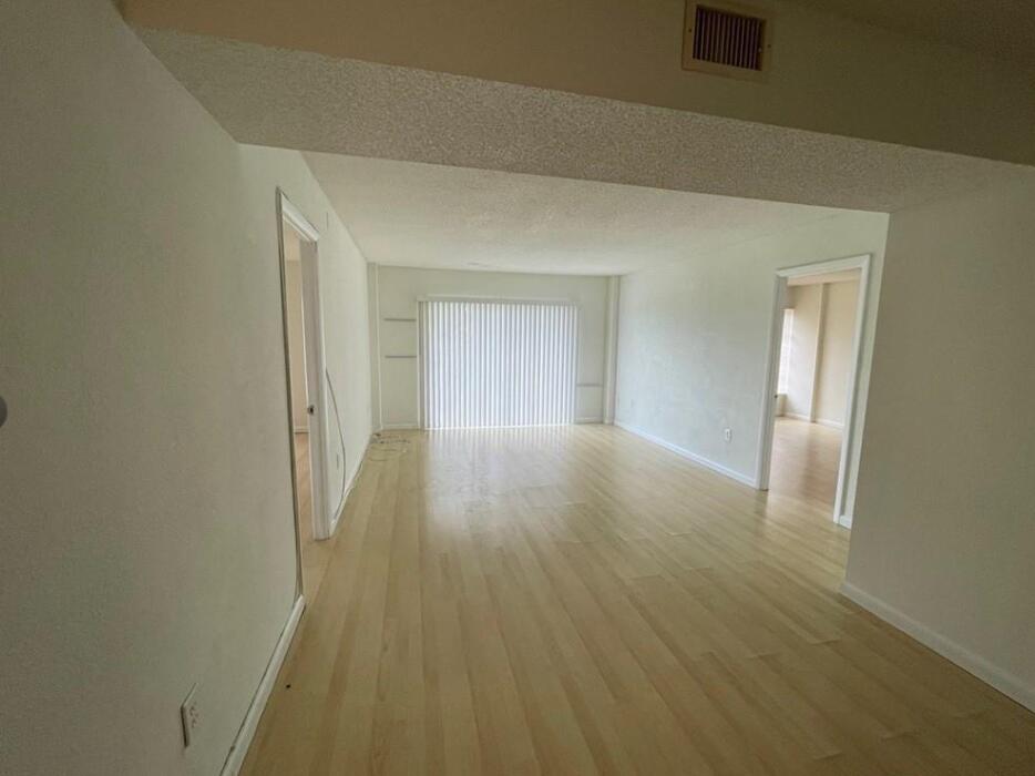 Welcome to this well-appointed two-bedroom, two-bathroom condominium located in the Manors . The unit features two full bathrooms, ensuring convenience for residents and guests alike.  Laminate Flooring Throughout. Amenities include Pool, Tennis, Fitness Room, Clubhouse. Located Close to Turnpike and University Drive with Shopping, Parks and Restaurants Close-by. Maintenance includes hot water, basic cable, and internet.