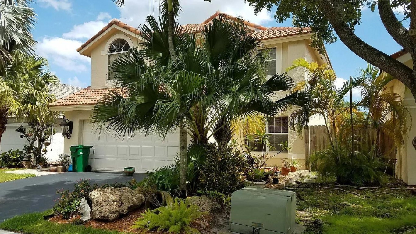 Welcome to this thoughtfully maintained 2-story single-family residence located in the heart of Margate’s 33063 zip-code—an ideal location for family living, with schools, shopping and easy commuter access nearby.Key Features4 generous bedrooms and 3 full bathrooms—ample space for living, guests or a home office. Approximately 2,241 sq ft of living area (per records) on a lot of about 6,098 sq ft. Constructed in 1989—well-established neighborhood with mature landscaping. Exterior features: stucco finish, tile roof. Classic hardwood flooring in key living areas for warm character and easy maintenance. Two-car garage and ample driveway parking.