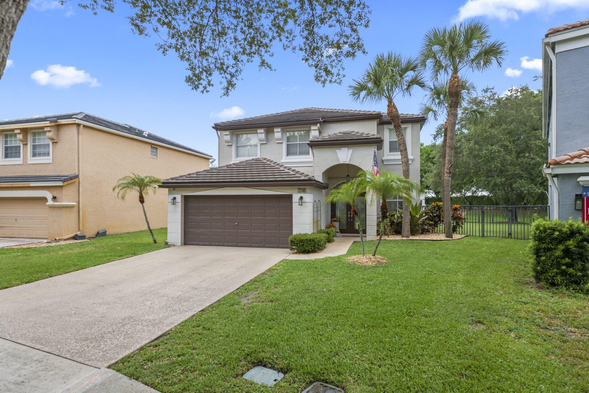 Welcome to this beautifully updated, move-in-ready pool home in the heart of Smith Farm, one of Lake Worth's most sought-after gated communities. This spacious 4-bedroom, 2.5-bathroom residence offers modern finishes, stunning lake views and a wonderful lifestyle.  Step inside to discover a thoughtfully refreshed and bright interior featuring updated guest bathrooms, new luxury vinyl flooring on the first level, and a beautifully updated and extended kitchen with new countertops, backsplash, and appliances. The functional floor plan provides generous living spaces and four spacious bedrooms, making it ideal for both everyday living and entertaining. Major updates including a 2021 roof, 2020 A/C, and all new appliances in 2024 that provide peace of mind for years to come.  Outside, enjoy the best of the Florida lifestyle - a beautiful salt-water pool , plenty of room to relax and entertain and a large turfed yard. It doesn't get better than this!   Residents of Smith Farm enjoy an incredible sense of community with year-round events such as food trucks, concerts in the park, and festive holiday celebrations. The neighborhood also offers resort-style amenities including a large pool, playgrounds, sports courts, a fitness center, scenic lakes and preserves, and access to A-rated schools, making it an exceptional place to call home. Homes with this combination of upgrades, space, and views are a rare find. Don't miss your opportunity to call this Smith Farm gem your next home.