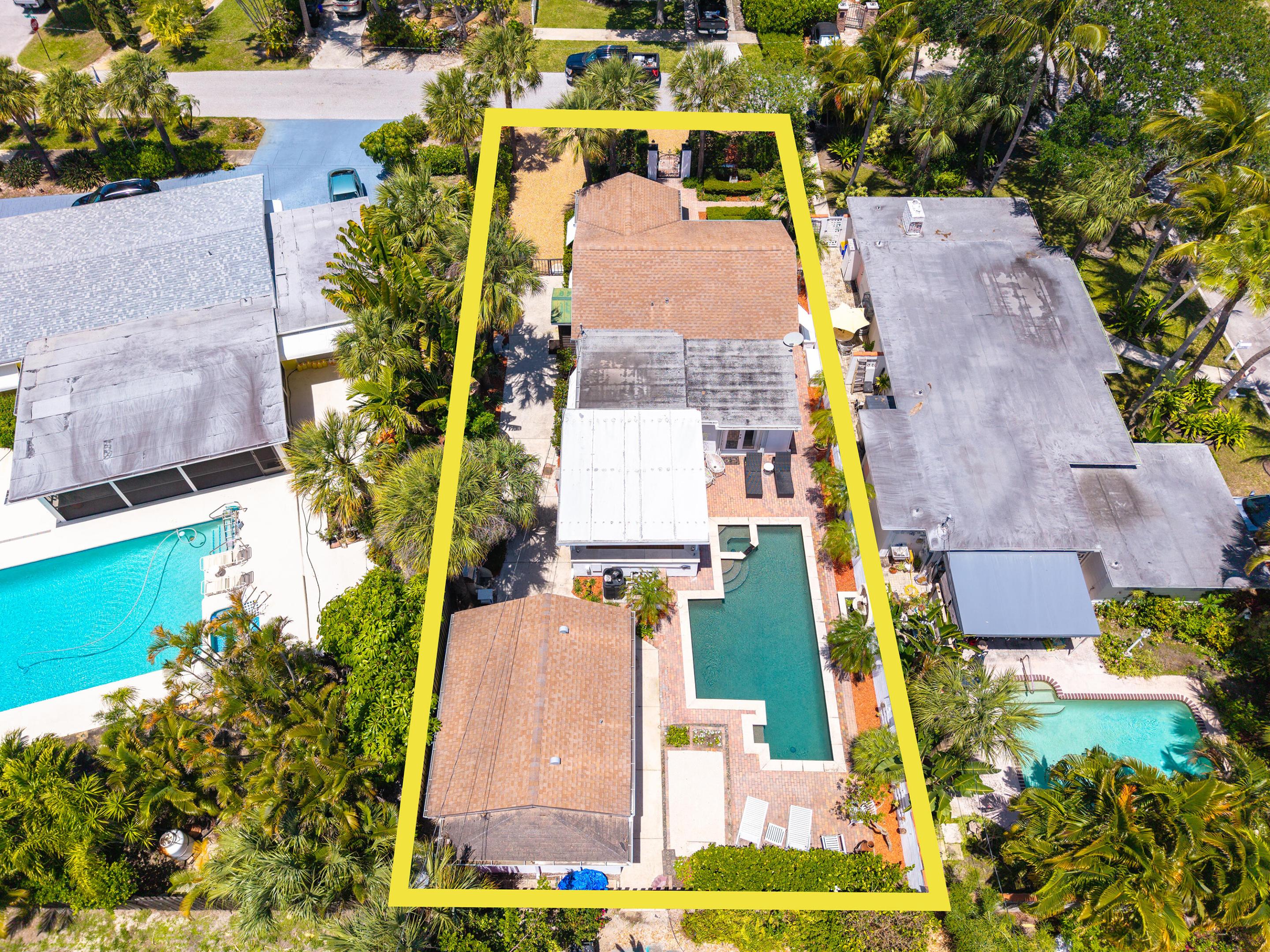 Welcome to 205 18th Ave N, a private tropical retreat located in the highly sought-after College Park neighborhood of Lake Worth Beach. Blending charm, versatility, and modern updates, this unique property offers a rare opportunity to enjoy a peaceful, resort-style setting just minutes from the Intracoastal, downtown, and the beach. Behind a gated entry, the home is surrounded by lush, mature landscaping that creates an immediate sense of privacy and tranquility. Fully enclosed, the property feels like a secluded oasis—perfect for those seeking both comfort and escape while still being close to everything South Florida has to offer. The main residence is filled with natural light, creating a warm and inviting atmosphere throughout. Thoughtful updates complement the home's original  character. With a new roof and a newer air conditioning system, giving  the added peace of mind and efficiency. The layout flows easily, making it well-suited for both everyday living and entertaining. One of the standout features of this property is its separate cottage, offering incredible flexibility. Ideal as a guest house, home office, studio, or income-producing rental, this additional space enhances both functionality and value. Whether hosting visitors or creating a private retreat, the possibilities are endless. Step outside to experience the true highlight of the home—a beautifully designed backyard oasis. The heated pool and spa serve as the centerpiece, surrounded by a spacious patio and deck that invite relaxation and connection. A covered outdoor area provides the perfect space for dining or lounging, while the surrounding tropical landscaping enhances the sense of calm and privacy. An outdoor shower adds convenience and completes the resort-like experience. The location is equally impressive. Situated in the desirable College Park neighborhood, the home is just moments from the Intracoastal Waterway, where scenic walks and waterfront views await. Downtown Lake Worth Beach offers a vibrant mix of restaurants, shops, and local culture, while nearby beaches provide easy access to sun and ocean breezes. In addition to its charm and livability, the property also presents an excellent investment opportunity. The separate cottage and prime location make it well-suited for rental income, whether seasonal or long-term. 205 18th Ave N is more than just a home—it's a lifestyle. From quiet mornings by the pool to evenings spent enjoying the tropical surroundings, this property offers a rare combination of privacy, flexibility, and location. A truly special opportunity to own a piece of paradise in one of Lake Worth Beach's most desirable neighborhoods. New roof 2026!