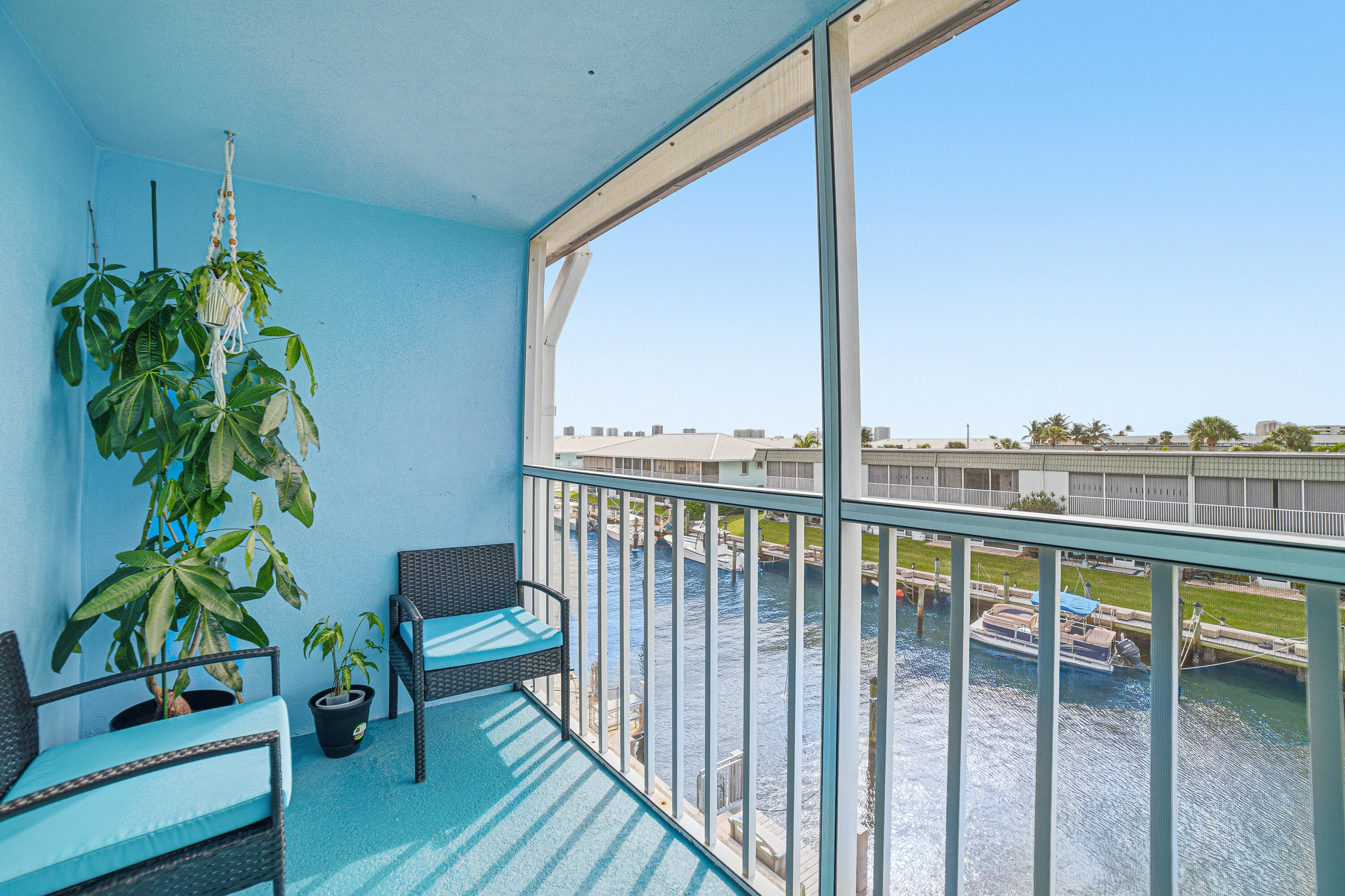 INTRACOASTAL VIEWS!! This adorable, newly remodeled, 2 bedroom, 1 bath, 3rd floor unit combines comfort and coastal charm, featuring a cozy layout with a water view from your living room and balcony.  A rare opportunity in this 55+waterfront community to lease a boat, upon availability, for only $2/ft!!  Features include; newly remodeled floor plan with water view from living room, modern sliding barn doors for bedroom privacy or open wide for entertaining friends, complete hurricane impact windows and slider, 2025 A/C, ceiling fans, crown molding, 4'' baseboards, updated kitchen, quartz and Corian countertops, partial soft-touch cabinetry, remodeled bathroom with tile flooring and new vinyl flooring throughout unit. Relax and enjoy the breathtaking morning sunrises and evening skyline of Singer Island while watching the boats go by.  You will LOVE the breezes off your screened in balcony while enjoying a good book or glass of wine! You are less than 2 miles from the beautiful Palm beaches, minutes away to 5-star restaurants, shopping, North Palm Country Club and Golf, the new Brightline train, 11 miles to the popular Jupiter Lighthouse & Museum and less than 20 min to Palm Beach International Airport. Your waterfront paradise awaits!