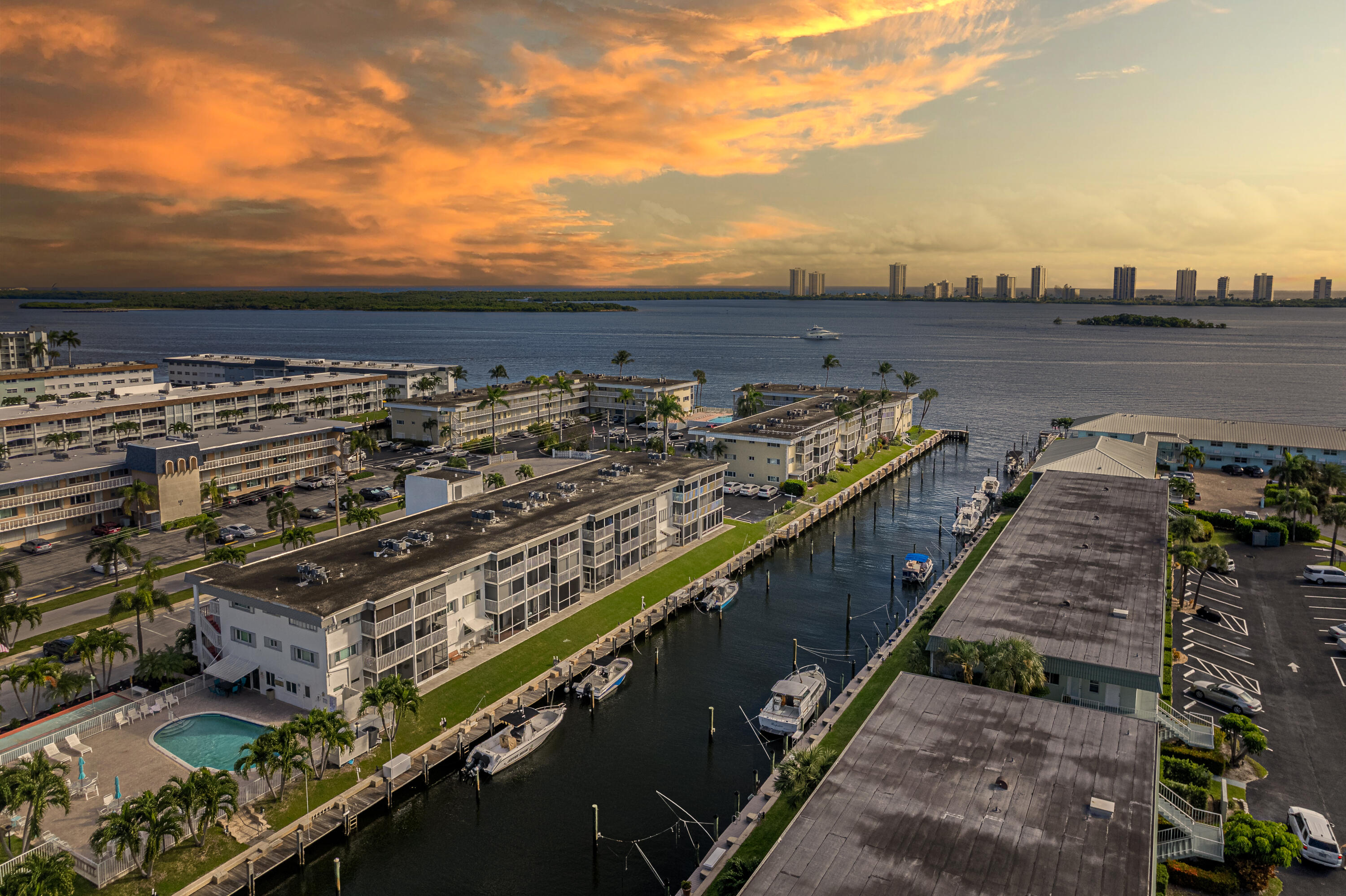INTRACOASTAL VIEWS!! This adorable, newly remodeled, 2 bedroom, 1 bath, 3rd floor unit combines comfort and coastal charm, featuring a cozy layout with a water view from your living room and balcony.  A rare opportunity in this 55+waterfront community to lease a boat, upon availability, for only $2/ft!!  Features include; newly remodeled floor plan with water view from living room, modern sliding barn doors for bedroom privacy or open wide for entertaining friends, complete hurricane impact windows and slider, 2025 A/C, ceiling fans, crown molding, 4'' baseboards, updated kitchen, quartz and Corian countertops, partial soft-touch cabinetry, remodeled bathroom with tile flooring and new vinyl flooring throughout unit. Relax and enjoy the breathtaking morning sunrises and evening skyline of Singer Island while watching the boats go by.  You will LOVE the breezes off your screened in balcony while enjoying a good book or glass of wine! You are less than 2 miles from the beautiful Palm beaches, minutes away to 5-star restaurants, shopping, North Palm Country Club and Golf, the new Brightline train, 11 miles to the popular Jupiter Lighthouse & Museum and less than 20 min to Palm Beach International Airport. Your waterfront paradise awaits!